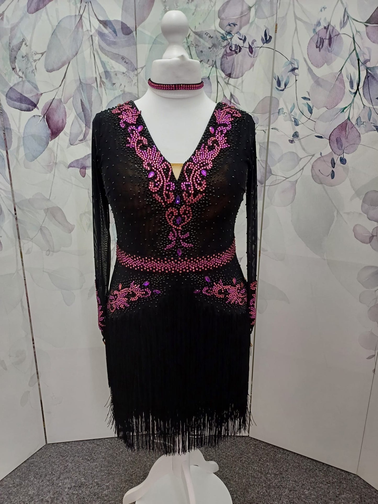 27L Black Latin Competition Dance Dress. Fuchsia Appliqué stoned in Fuchsia, Rose & Black. Optional Belt. High back giving option to wear own bra. Full fringed skirts.