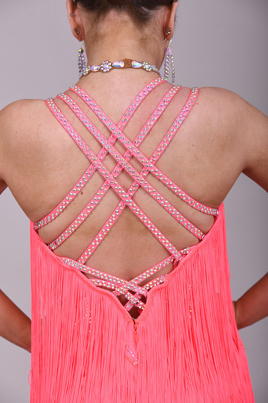 237 Bright Coral Fringed Dress. Decorated in AB stones with strapping detail to the shoulders & back. Matching Skirt, Floats & Belt available on request £135 extra