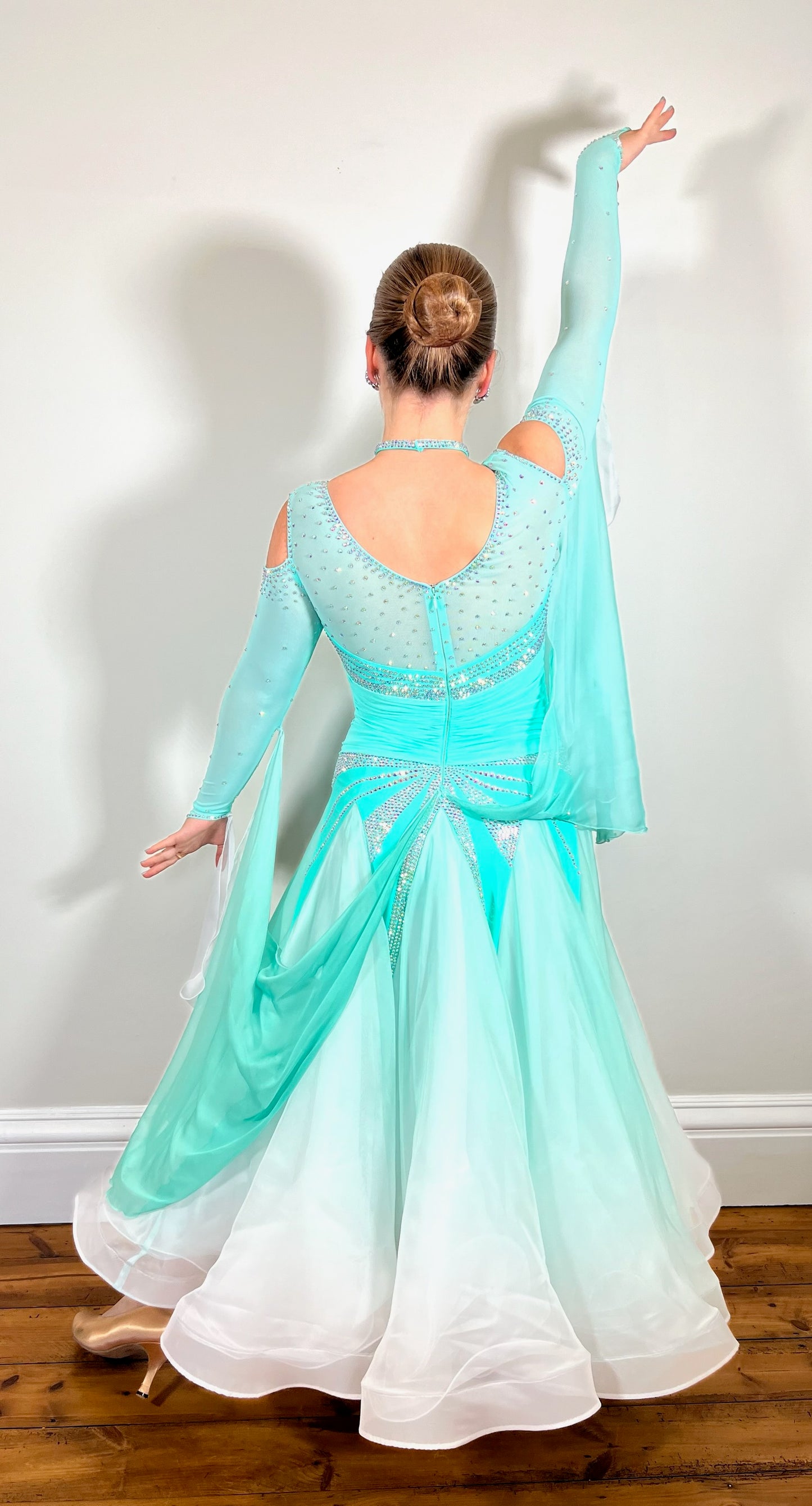 054 Spearmint Green & White Ombre Competition Ballroom Dance Dress. Rouched panel to the waist area. High back with cold shoulder sleeves. Stoned in AB with detachable floats