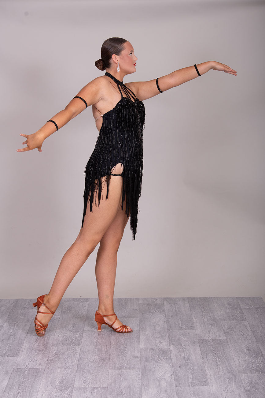 133L BUDGET (23) Black  Competition Latin Dance Dress. Beading detail to upper chest. Bead droppers with fringed skirt  Stoned in jet ❤️Showroom Appointments Available❤️