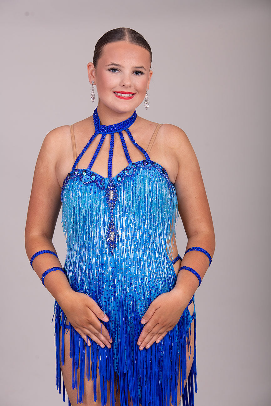 (BUDGET)20 2 Tone Blue Competition Latin dress. 2 Tone bead droppers & Fringe with strapping detail to the front & hips. Flesh security shoulder straps