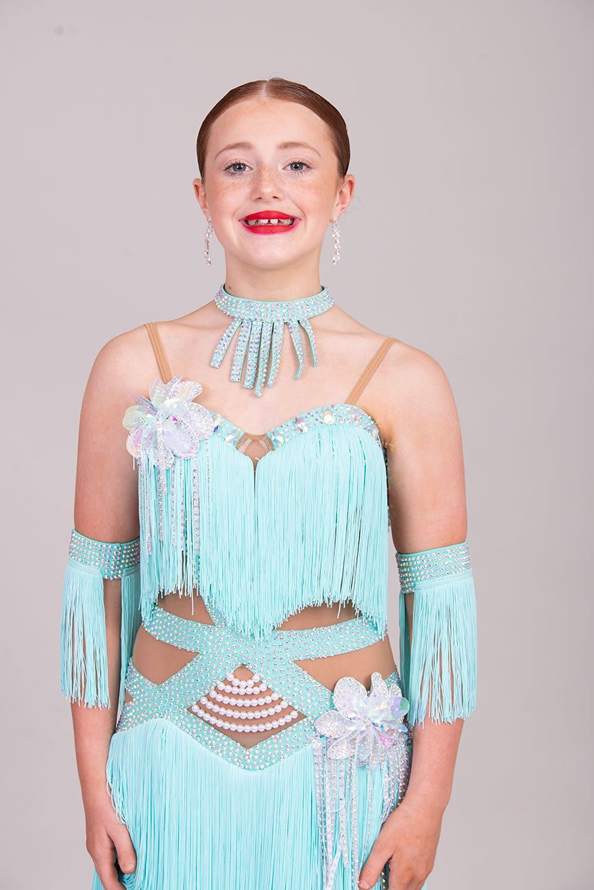 (BUDGET)8 Icey Blue Latin Competition Dance Dress. stoned AB & pearls. Flower to chest & hip, fringe skirts.                                           *****Our New Budget Range are Bought in ready made Costumes, with some detail added by TWDance*****
