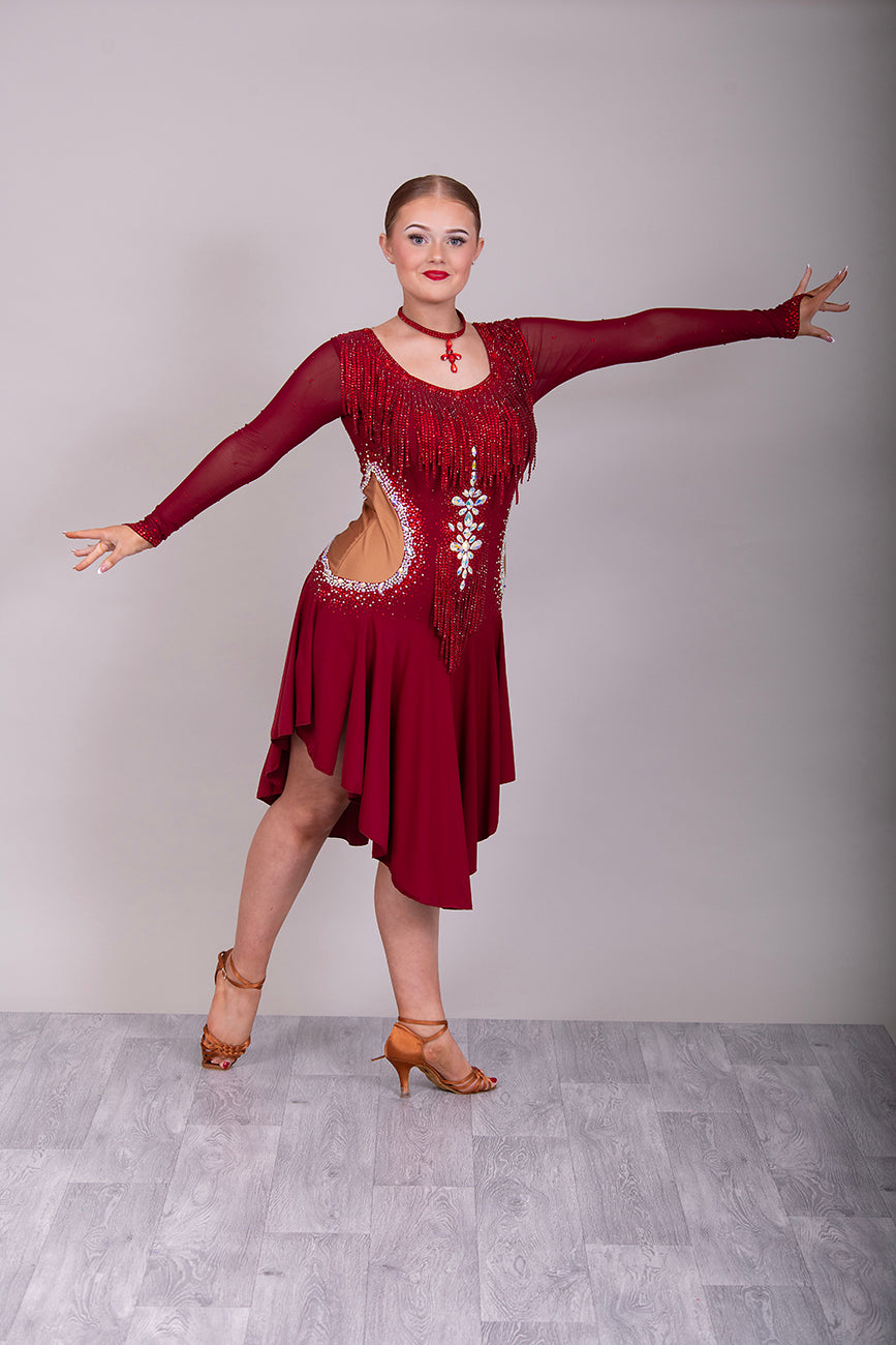 052 Wine Colour Latin Competition Dance Dress with heavily stoned stunning design in AB & Dark Siam High Mesh Back to give option of wearing own Bra. Flesh colour Lycra side panels (not see through) giving the illusion of cut outs.