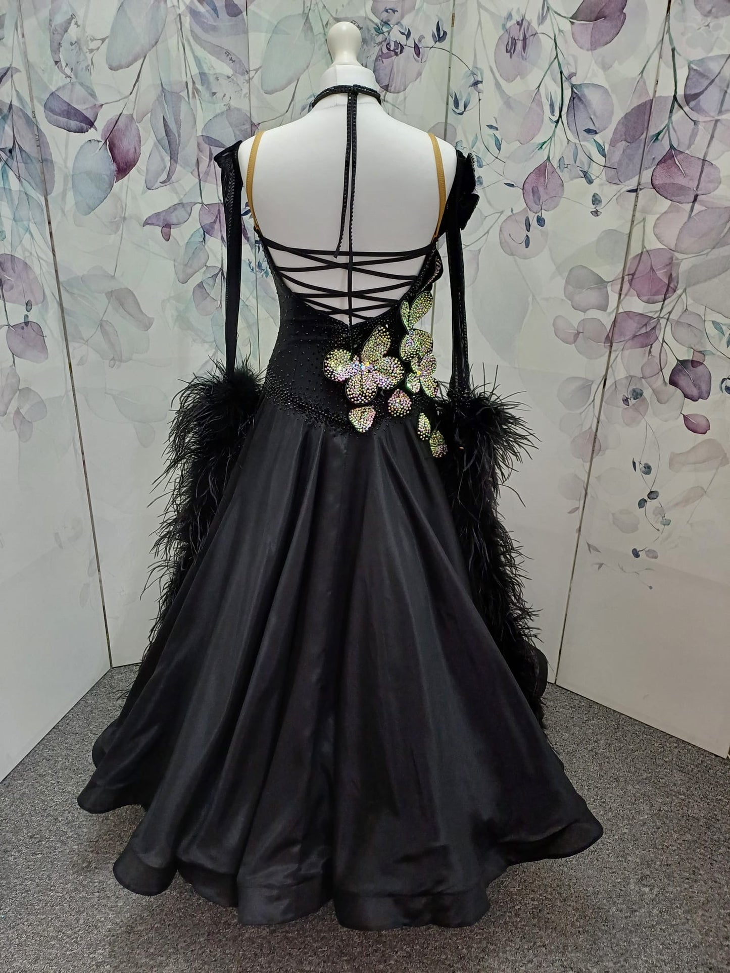 57B TWD “ELITE” Striking Black Ballroom/Sequence Competition Dance Dress. 3D Flowers heavily stoned in AB with Jet stoning throughout. Detachable Ostrich Feather Floats & Long Gloves ❤️Showroom Appointments Available❤️