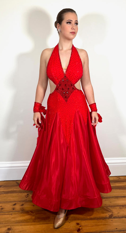 219 Red Sleeveless/Backless Ballroom/Smooth halter neck Dress. Feature panelling to the waist. Long Glove let’s with feather detailing. Flesh strapping to the chest and back.