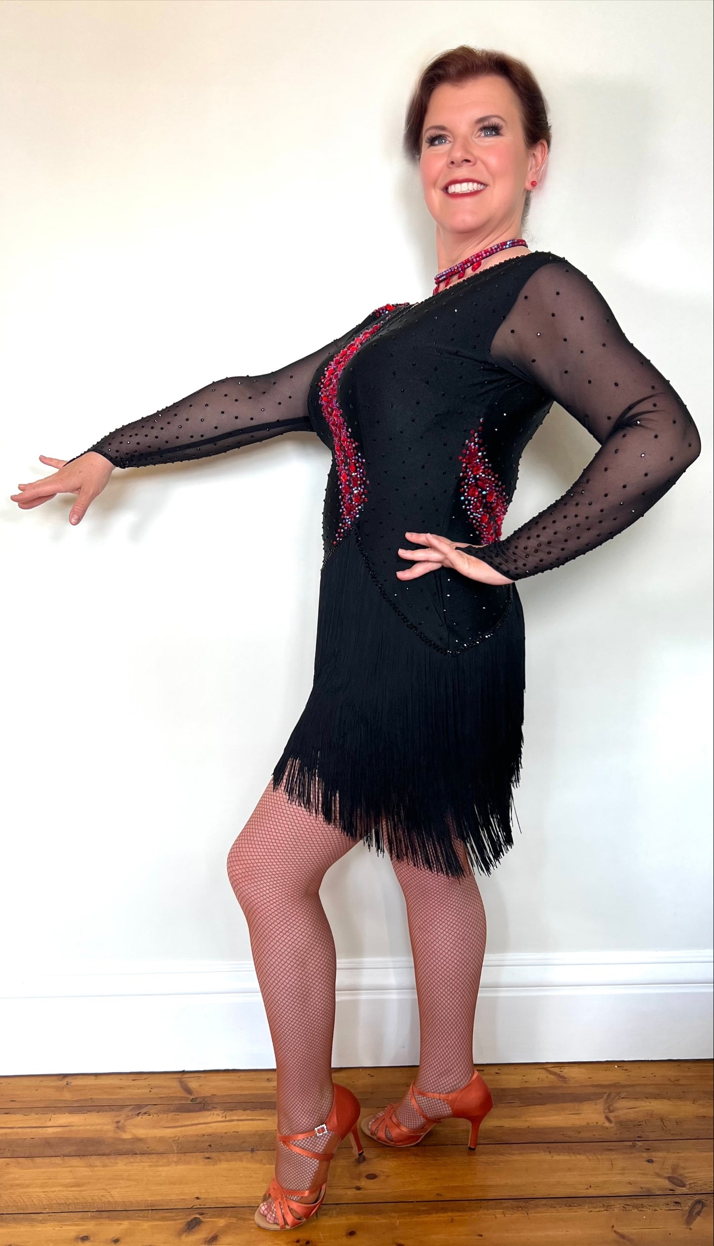 283 Black & Fuschia Pink Latin Dance Dress. Black Fringe detailed skirt design. Stoned in Red, Red AB & Jet. High back to wear own bra if needed.