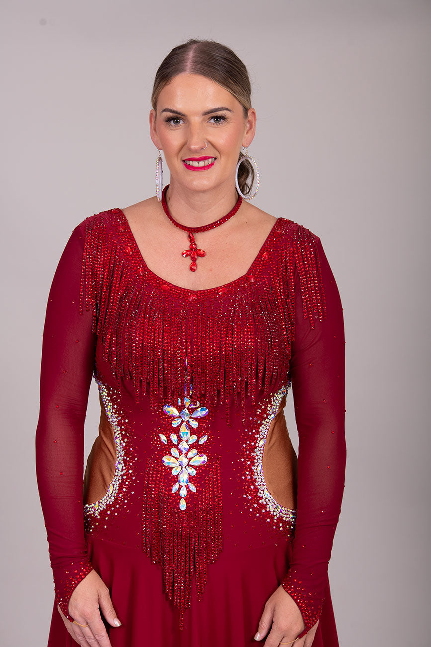 052 Wine Colour Latin Competition Dance Dress with heavily stoned stunning design in AB & Dark Siam High Mesh Back to give option of wearing own Bra. Flesh colour Lycra side panels (not see through) giving the illusion of cut outs.