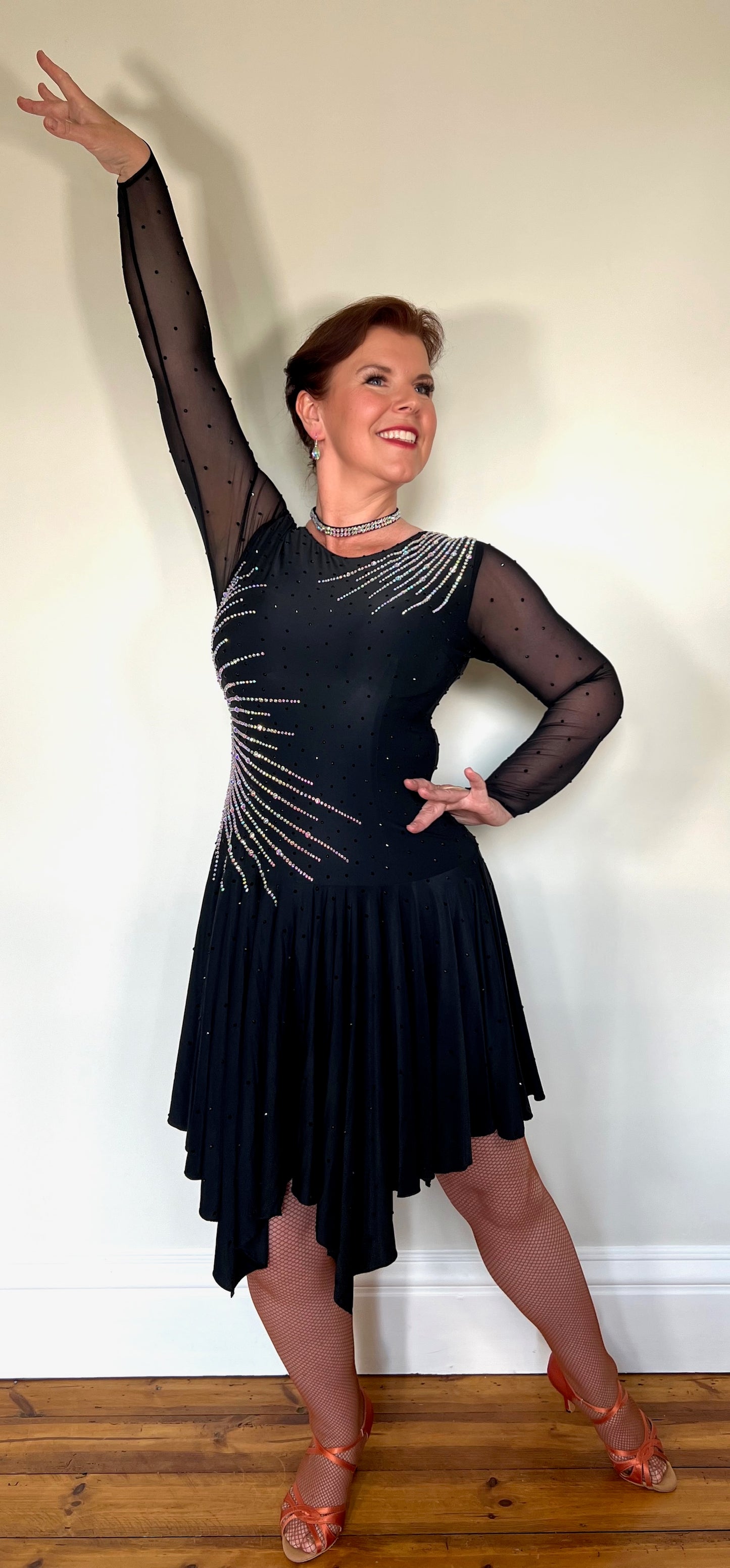 199 Flattering Black Latin Dance Dress. Super Stretchy. Stoned in AB starburst design with handkerchief hem skirt. High back giving option for wearing own bra.