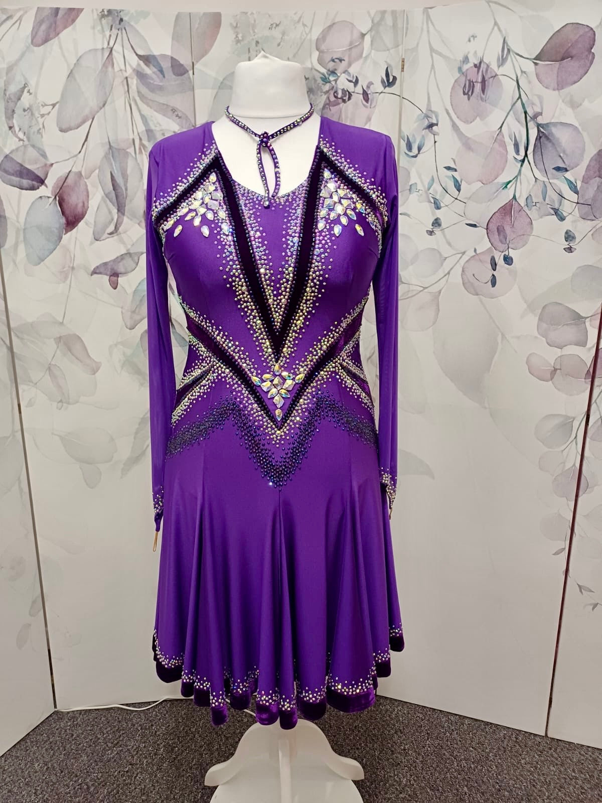 041 Cadbury Purple Competition Latin Dance Dress. Deep purple contrast pattern heavily stoned in AB & Amethyst AB. Bold & Flattering design. Full skirt giving maximum movement.