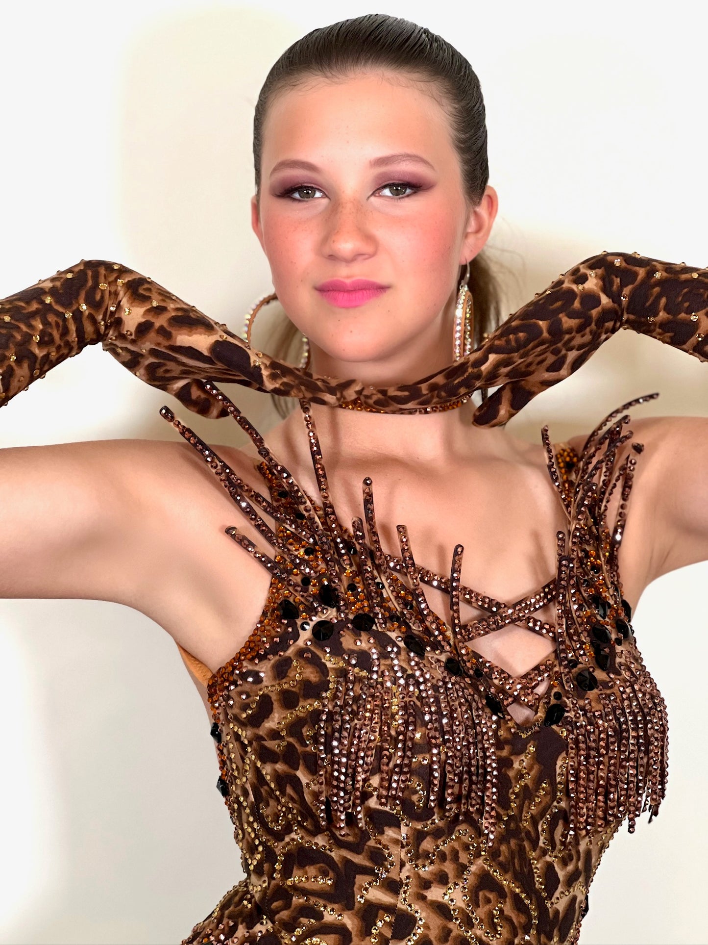 180 Stand out Leopard  Latin Dance Dress. Heavily stoned in Topaz, Light Topaz & Golden Shadow. Tassel & detailing to the chest area. Full bodysuit.