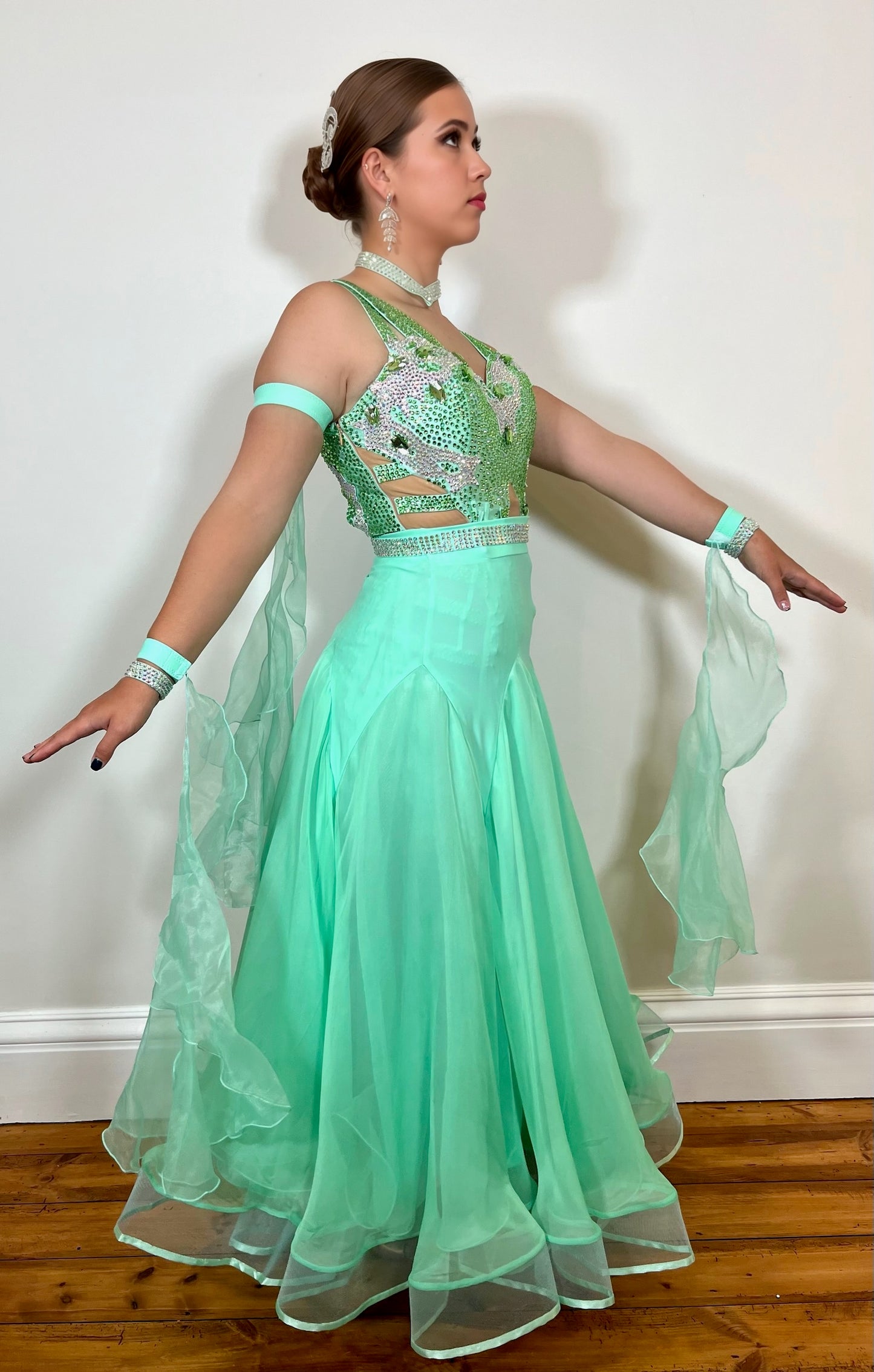 026 Mint Green Latin Dress with a Ballroom Skirt, x4 floats on bands & AB stoned belt. Latin dress with full material fringe, white motifs & stoned in AB