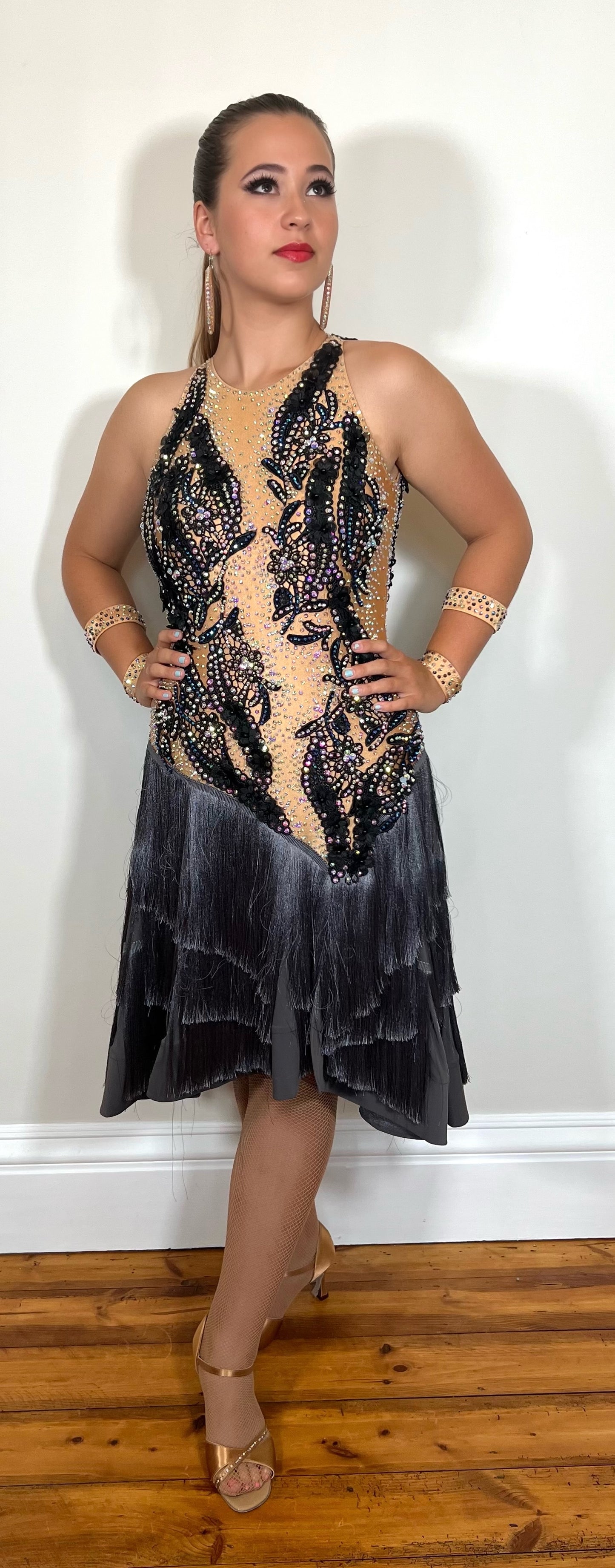 126 Gunmetal Grey layered fringe Latin Dress. Black appliqué on flesh bodice decorated with AB stones.