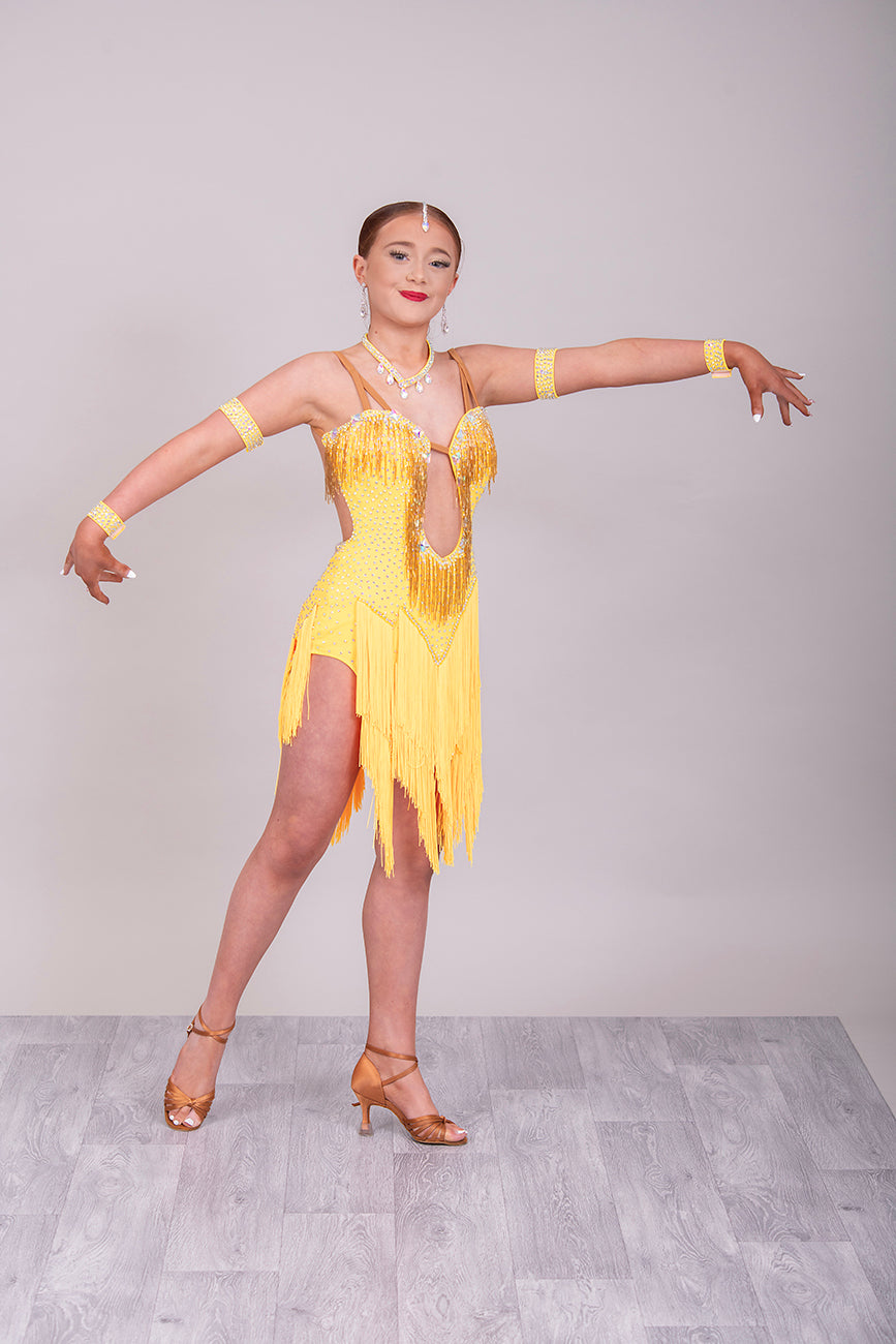 260 Yellow Fringe detailed skirt Latin Dress. AB stones with golden droppers to the chest. Open detailing to the front.