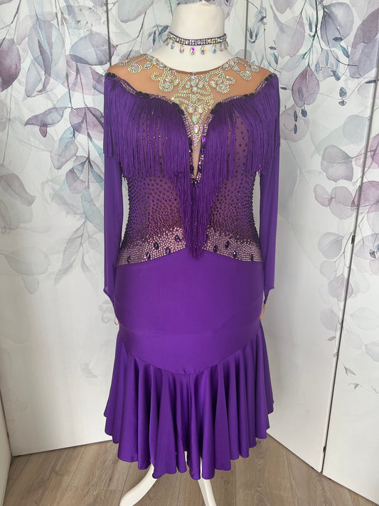216 Purple Latin Dress with intricate stoning at chest. Full frill giving lovely movement to skirt. AB heavily stoned neckline. Stoned in purple, light rose, magenta & AB