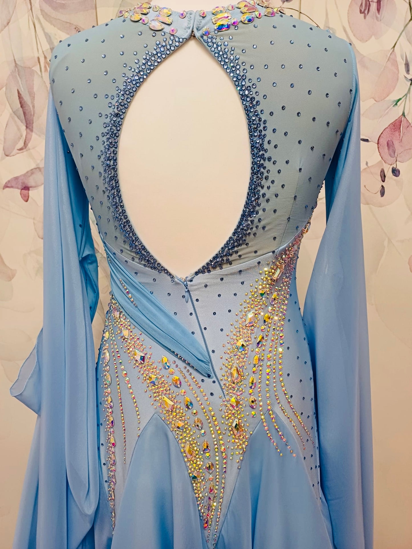 007 Light Blue Competition Ballroom Dance Dress. Heavily stoned in AB & Blue. Mesh overlay to one side of the bust continuing round to the back. Comes with detachable floats.