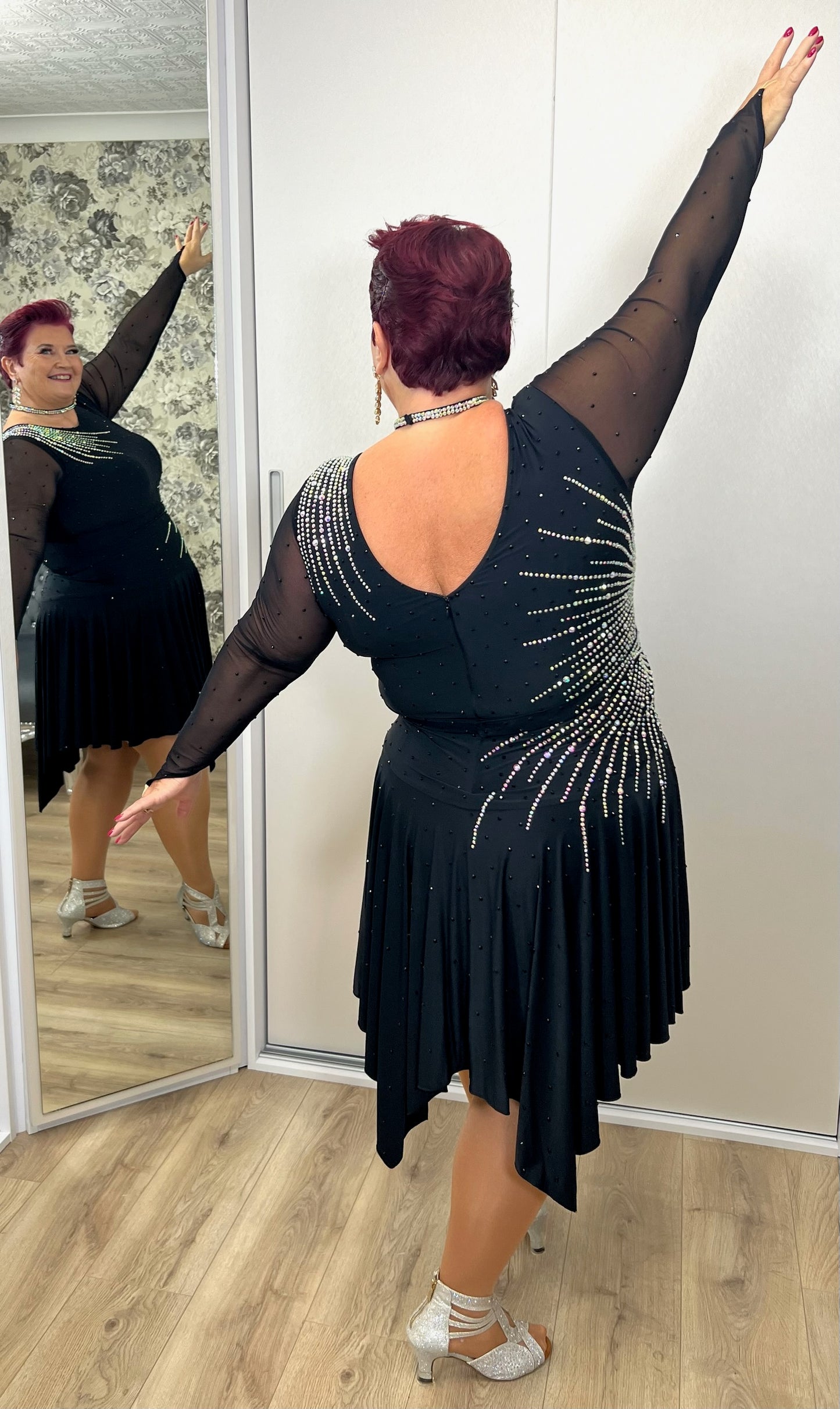 199 Flattering Black Latin Dance Dress. Super Stretchy. Stoned in AB starburst design with handkerchief hem skirt. High back giving option for wearing own bra.