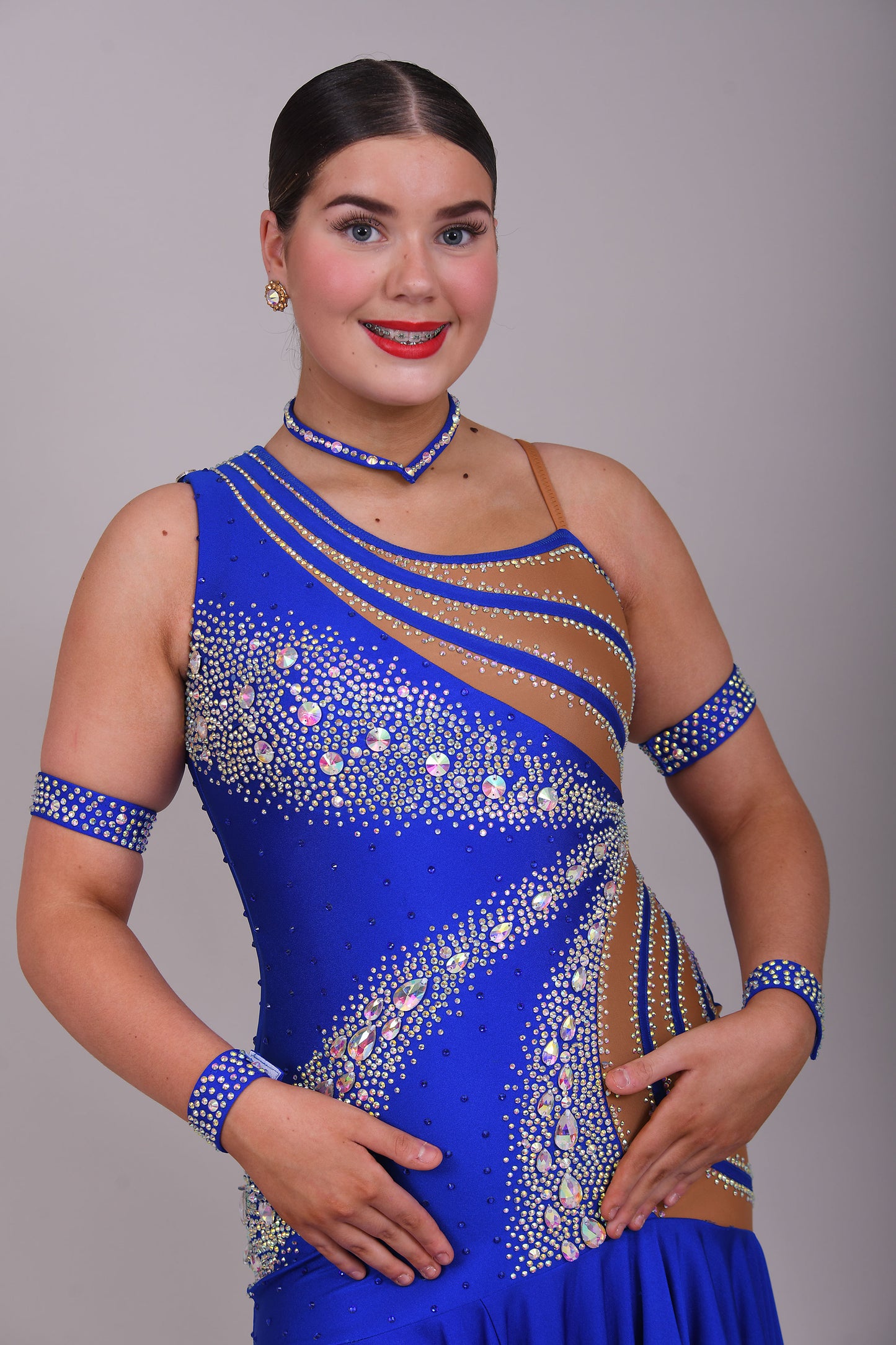 138 Bright Electric Blue One Shoulder Latin Dress. Tan Lycra to one side & heavily stoned in AB. Full frill effect skirt.