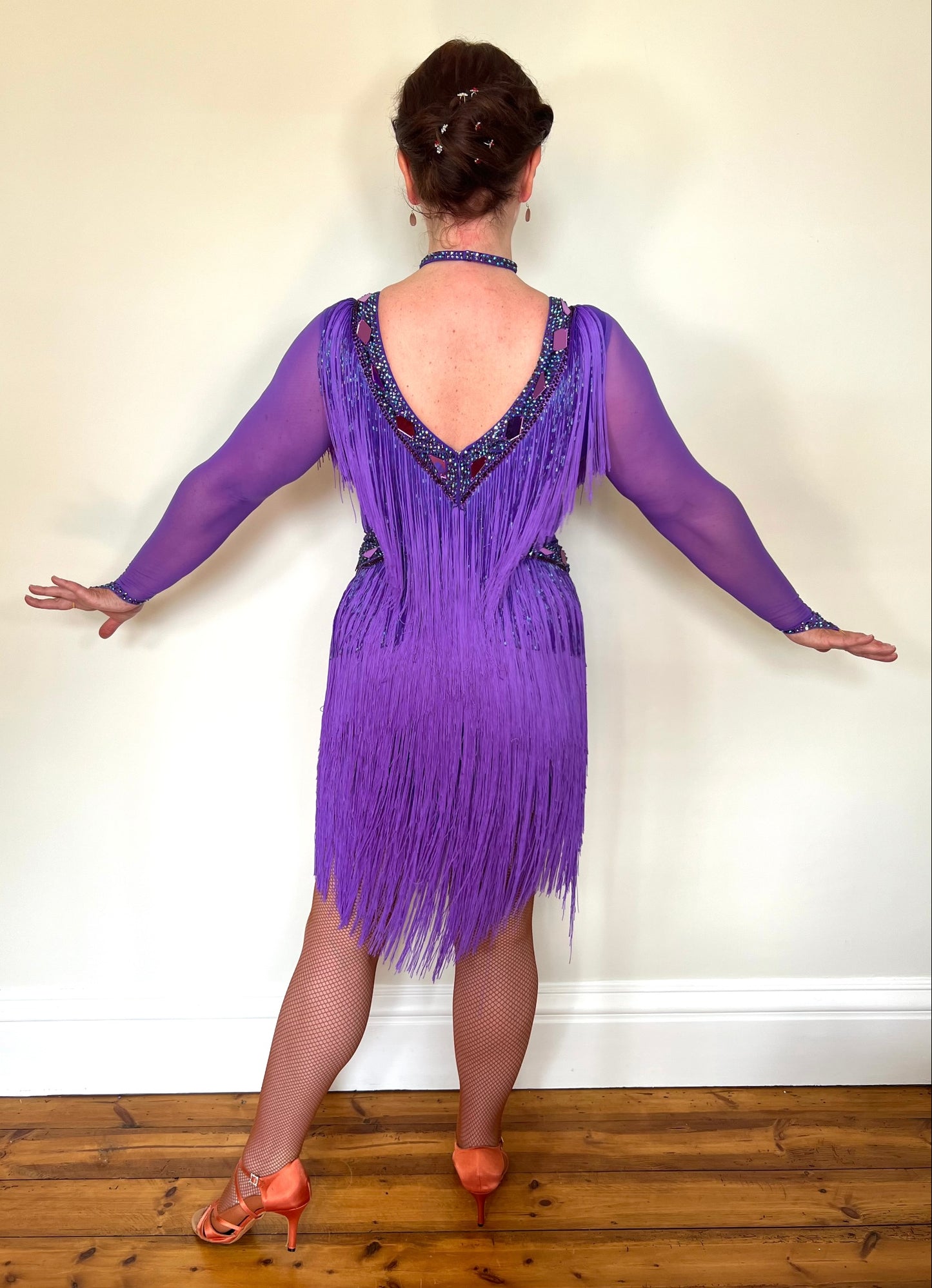 181 Purple Latin Dance Dress. Very full layered fringe. Decorated with purple mirrors, purple bead droppers and purple ab stones. High back to give option for wearing own bra.