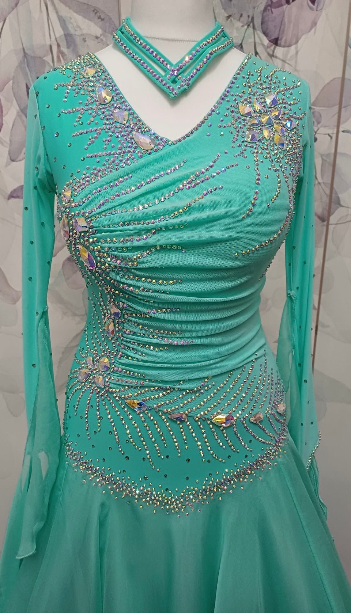 051. Stunning Mint Green Competition Ballroom Dance Dress. Heavily stoned in AB with Mesh detailing to the front. Detachable floats