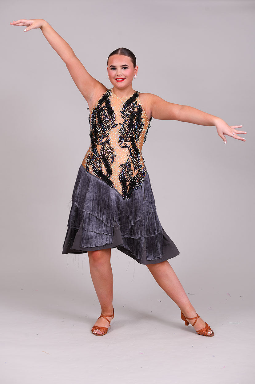 126 Gunmetal Grey layered fringe Latin Dress. Black appliqué on flesh bodice decorated with AB stones.