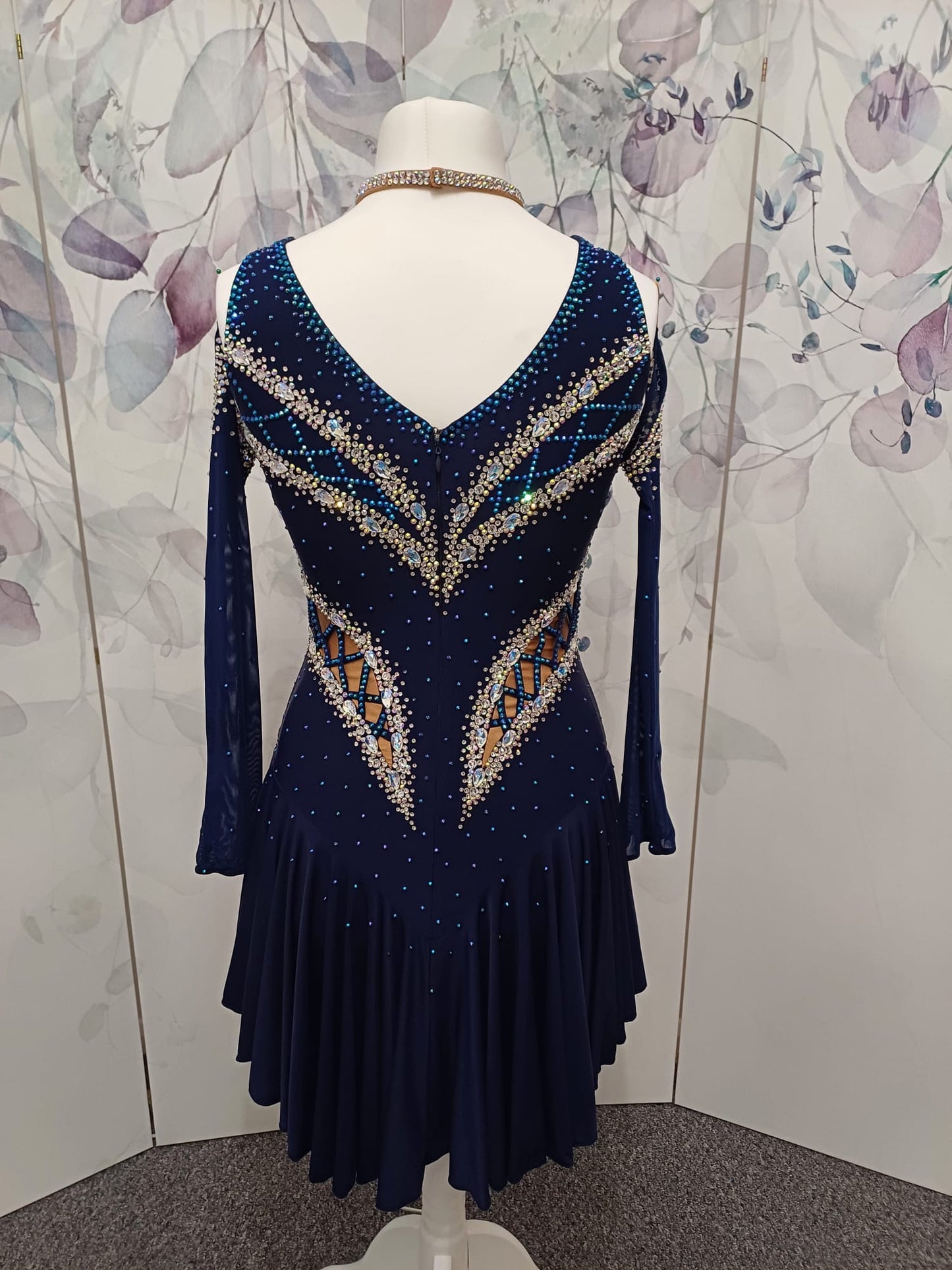 12L Navy Blue Competition Latin/Rhythm Dress. 3D Design to upper chest with flattering detailing to Hips. High back giving option to wear own Bra. Stoned in Blue, Blue AB & AB
