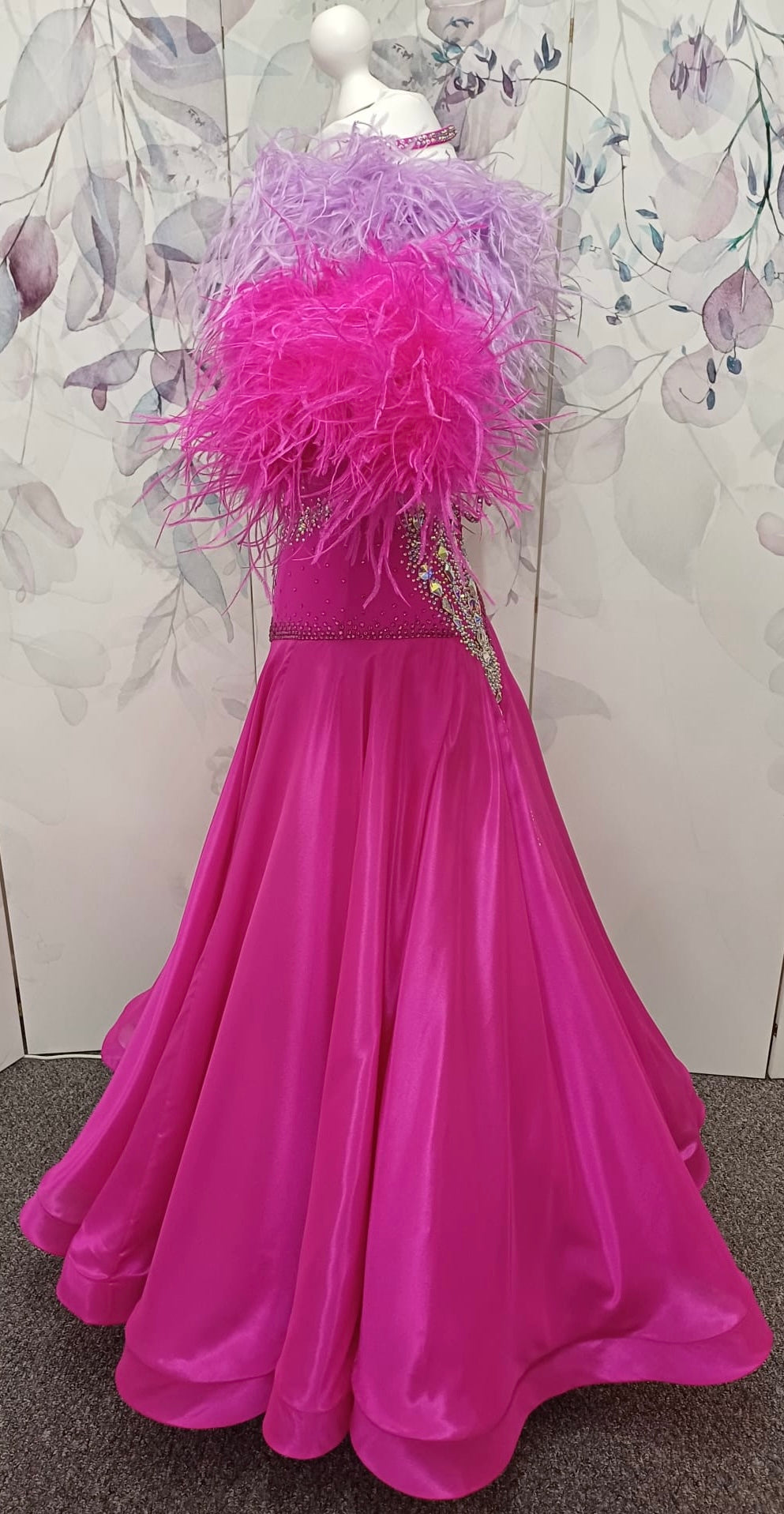 005 Cerise Pink Competition Ballroom Dance Dress. Heavily stoned in AB and Fuchsia & lilac. Comes with ostrich cuffs in Lilac & Cerise. Beautiful back detail.