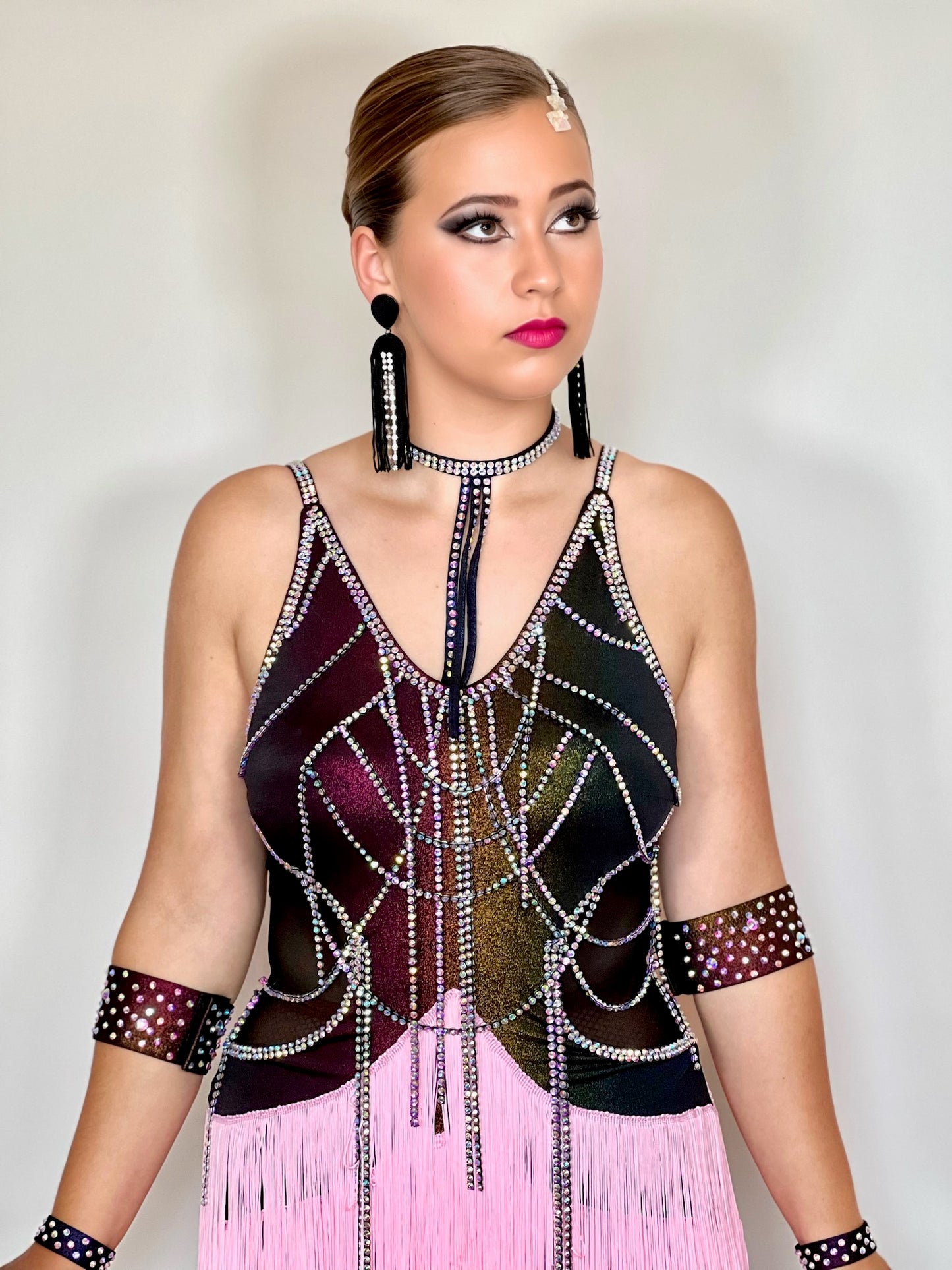006 Multi Coloured metallic bodice with hanging material droppers. All stoned in AB with pale pink multi layered fringe skirt.
