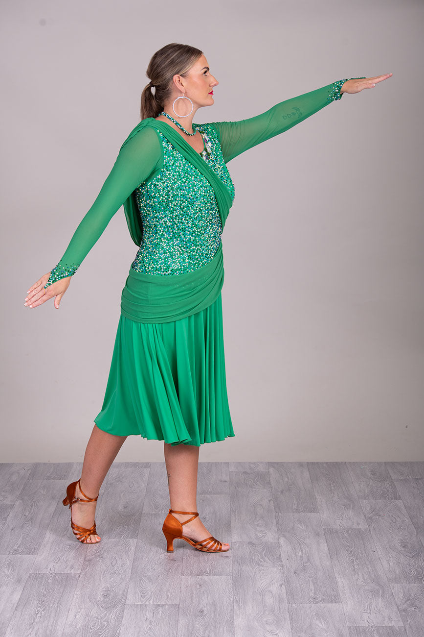 115L Emerald Green Competition Latin Dance Dress. Stunning dense stoning in AB, Emerald & Emerald AB. Sash details to the chest & Hip. High Back to give option of wearing own bra