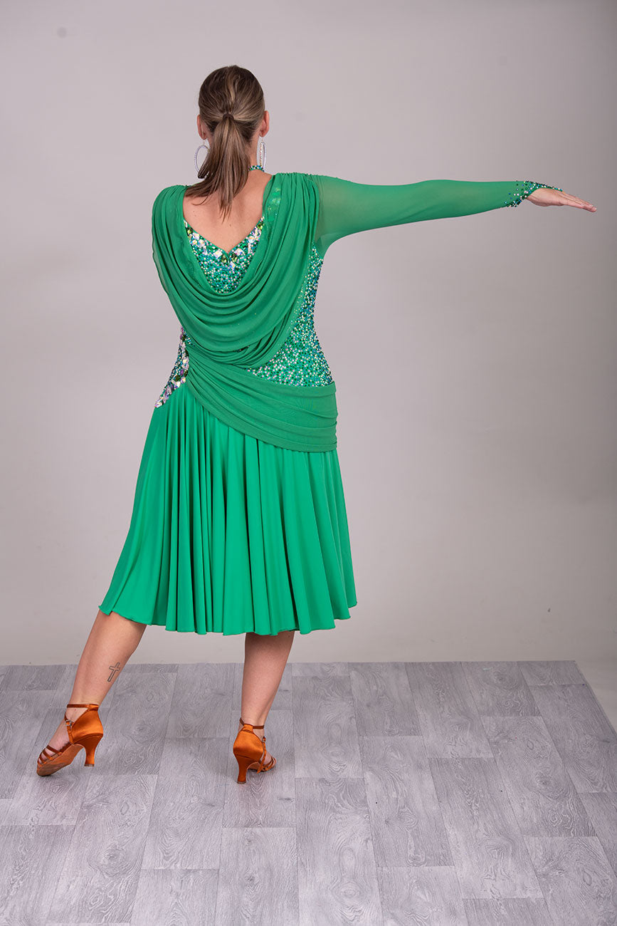 115L Emerald Green Competition Latin Dance Dress. Stunning dense stoning in AB, Emerald & Emerald AB. Sash details to the chest & Hip. High Back to give option of wearing own bra