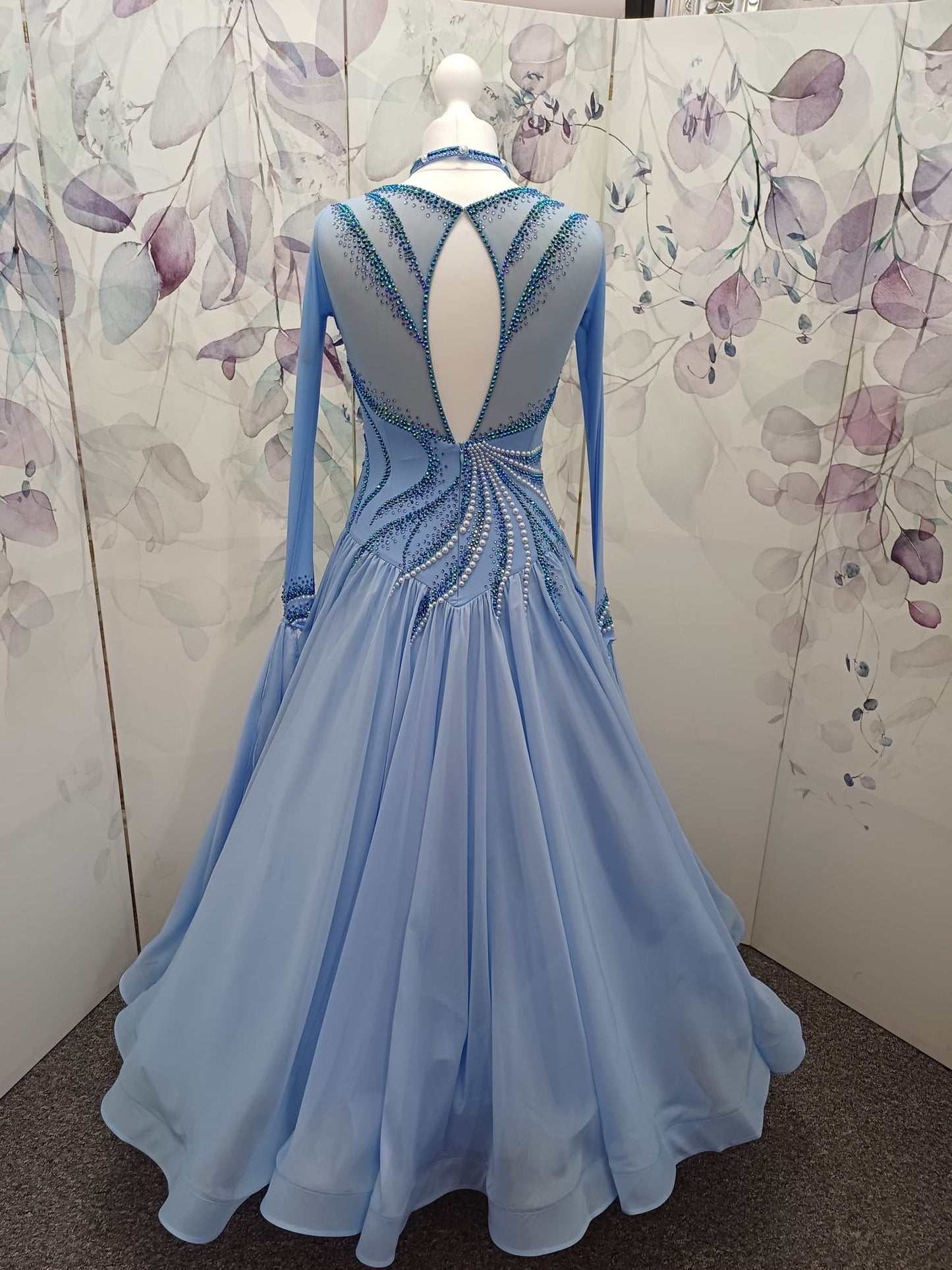 60B TWD ELITE Sky Blue Competition Ballroom/Sequence Dance Dress. New Fuller skirts & Underskirts. Beautiful patterning in Light Sapphire, AB & Light Sapphire AB with White Pearls. Narrow keyhole back. Detachable floats.❤️Showroom Appointments Available❤️