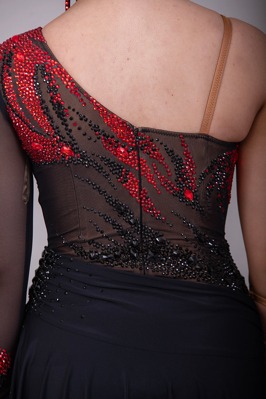 011L Stunning Black & Red Competition Latin  Dance Dress. Black mesh over Tan Lycra bodysuit. Stoned in Light Siam & Jet with decorative wrist/arm cuffs. Full black floaty skirts. Comes with optional black belt.