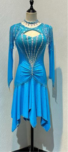 48L Light Turquoise Competition Latin Dance Dress. Stoned in AB & Aquamarine with stoned tassels & upper chest keyhole detail to the front. Rouching detail to the upper hip. Very full skirt for maximum movement. ❤️Showroom Appointment Available❤️