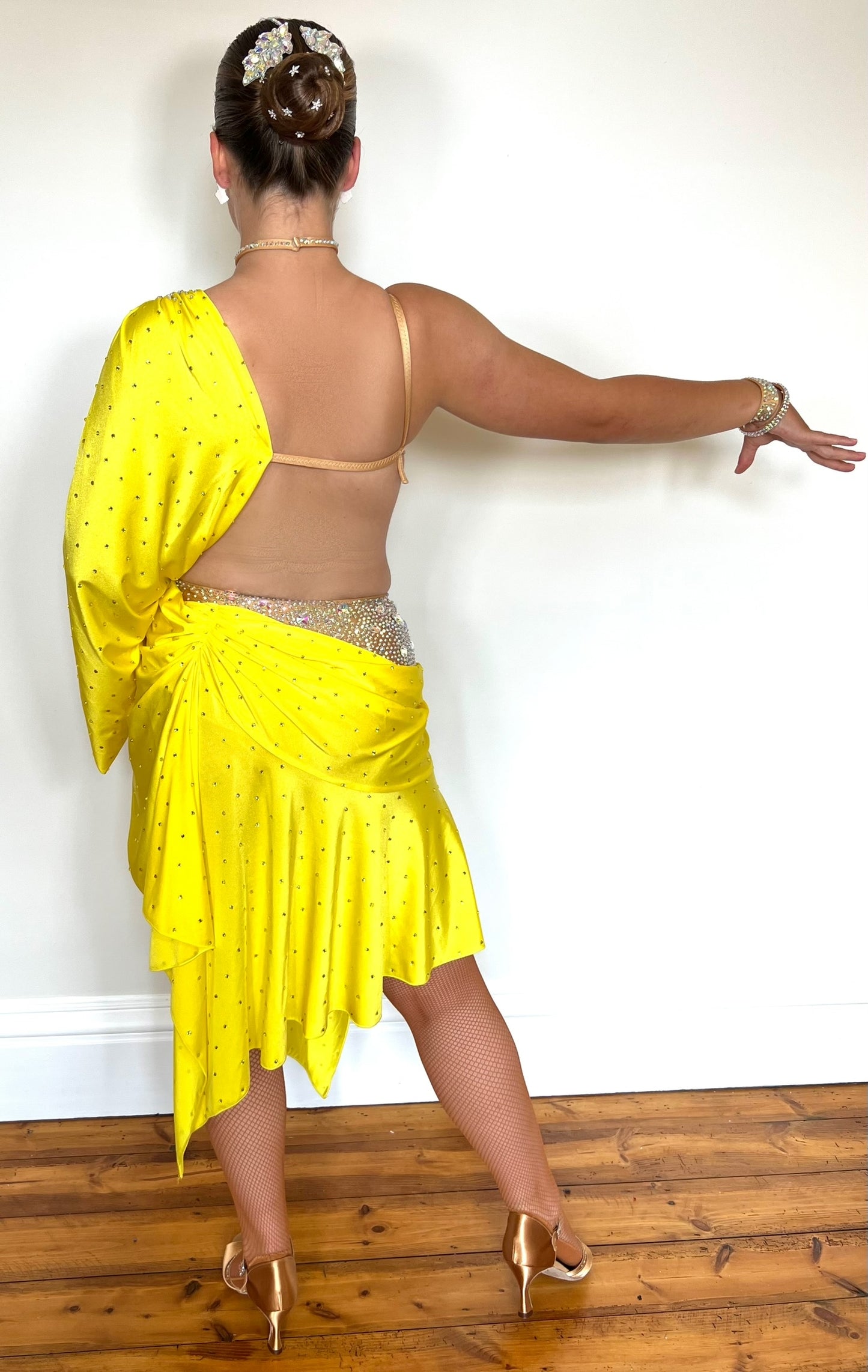 083 Yellow Lycra one Shoulder Latin Dress. Flesh leotard decorated in AB stones. Full frilled skirt for maximum movement.