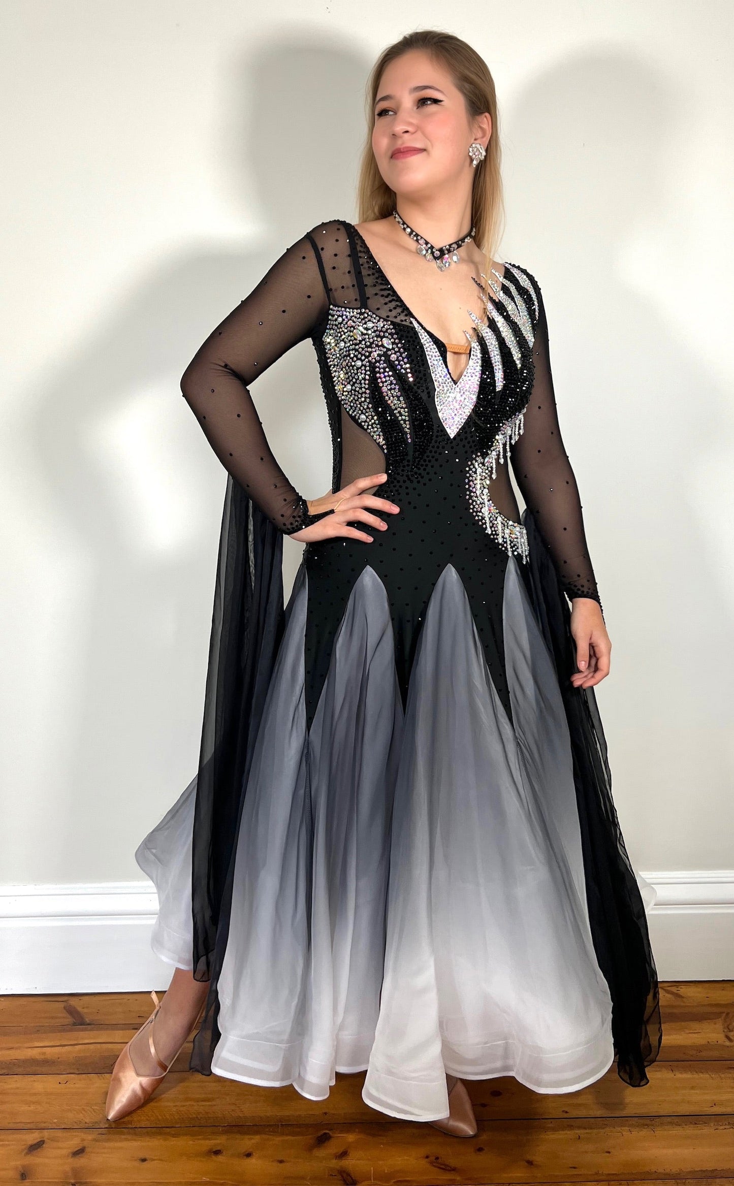 331 White & Black Ombré Ballroom Dress. Detailing to the chest and back. Decorated in Jet and AB stones with floats from the lower arm.