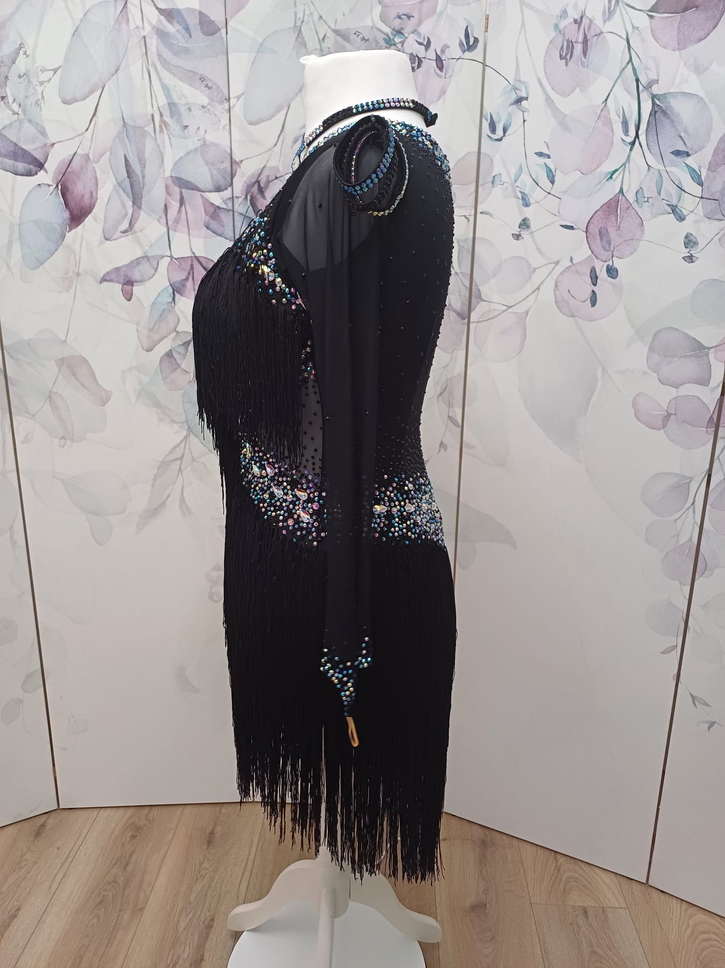 00111 Stand out stunning black fringed Latin Dance Dress. Full fringe giving maximum movement on the floor. Stoned in Jet, AB & Sapphire ab. High back to give option of wearing own bra.