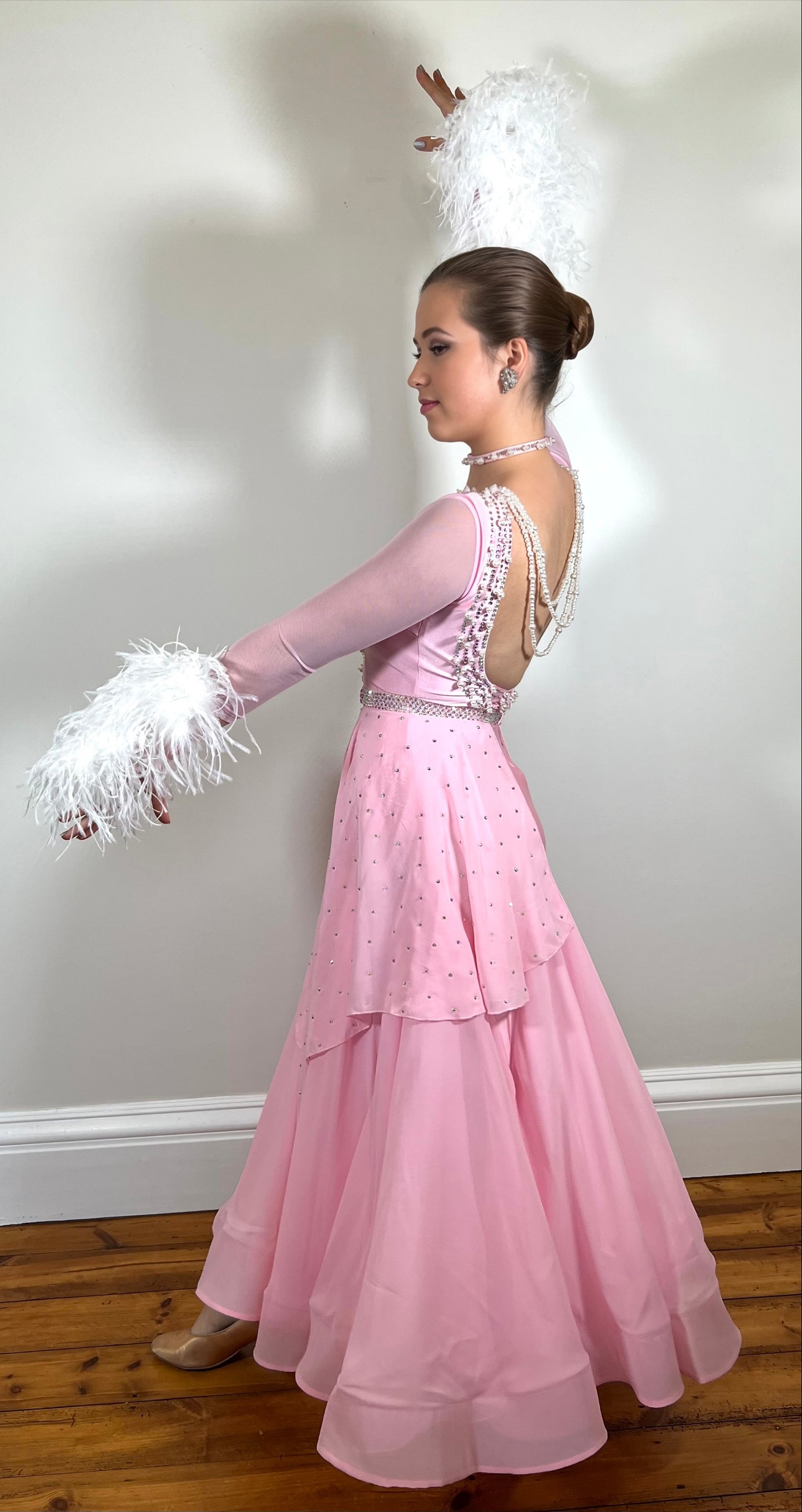 226 Pale Pink Ballroom/Smooth Dress. Decorated with Light Amethyst stones & pearls. Ostrich feather cuffs and drape decoration to the waist area front & back