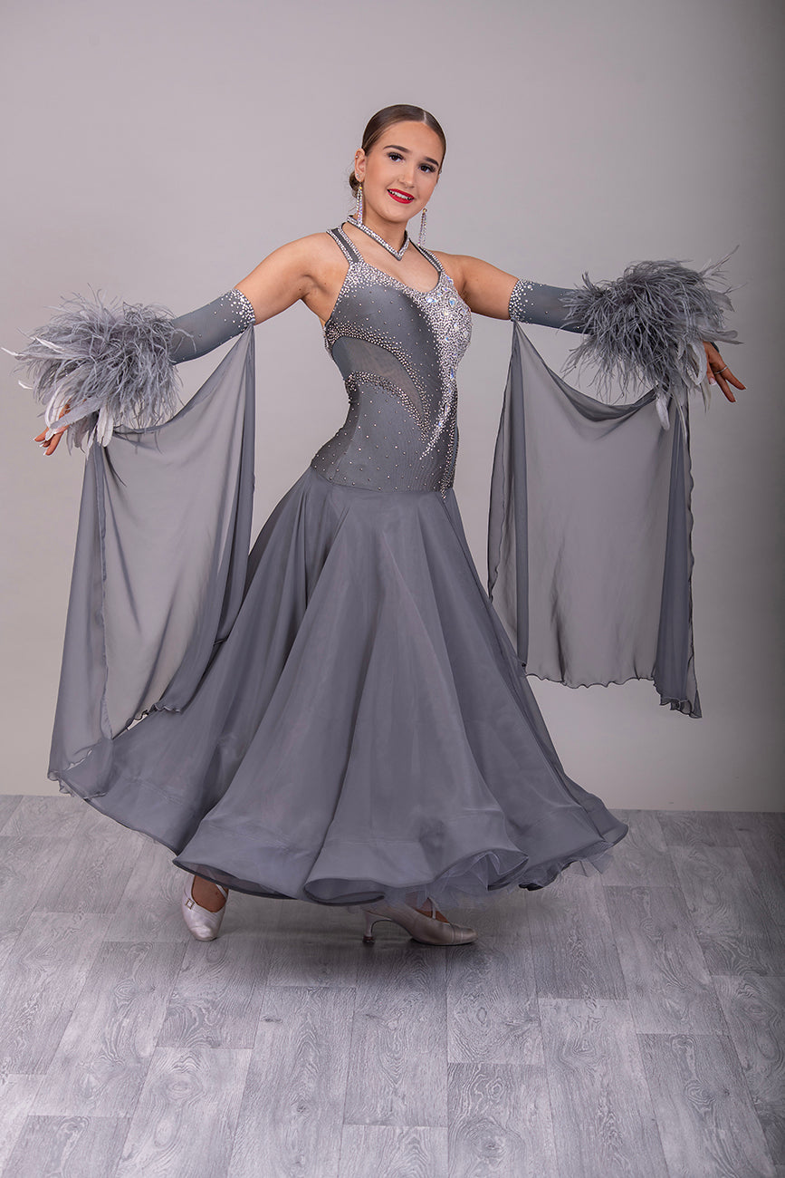 18B Hematite Ballroom/Sequence Competition Dance Dress. Heavily Stoned in AB, Moonlight & Jet Hematite. Detachable Floats & extra Feather Cuffs. Necklace with hanging details to the back.