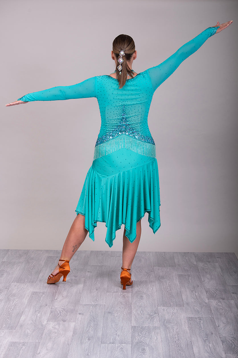 0101 Latin Dance Dress. Very full skirts giving maximum movement. Beading to the chest & waist area. Bodice back & front mesh with flesh under to allow the option to wear own Bra. Stunning stoning detail.