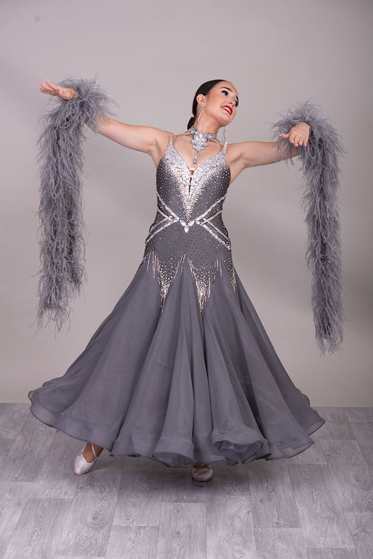 22B “TWD ELITE” New Fuller Skirts/Underskirts Pale grey Ballroom/Sequence Competition Dance Dress. Stunning stone design in Crystal with 3D features to the upper bodice and sides. Detachable Ostrich feather Floats with hanging back detail.