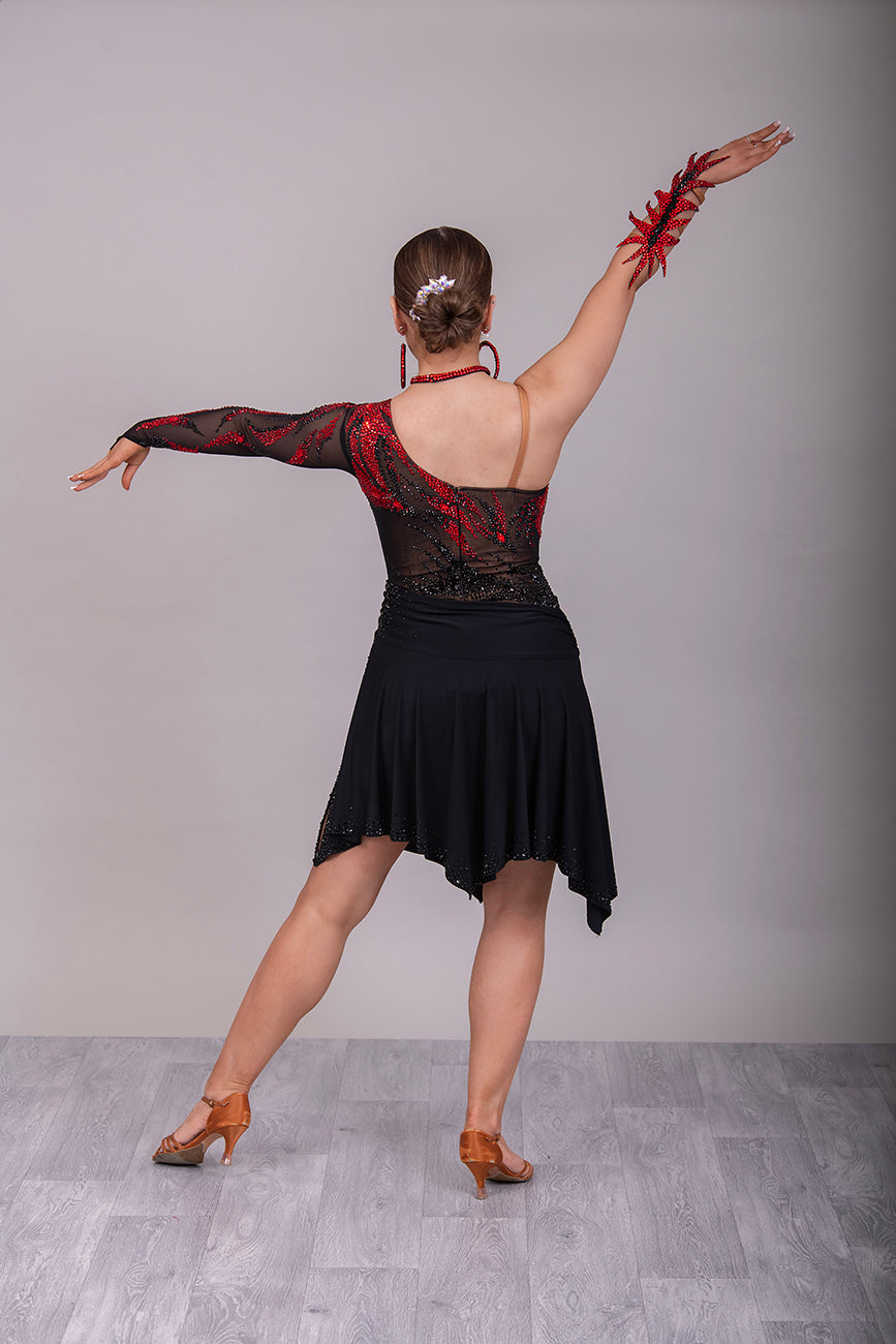 011L Stunning Black & Red Competition Latin  Dance Dress. Black mesh over Tan Lycra bodysuit. Stoned in Light Siam & Jet with decorative wrist/arm cuffs. Full black floaty skirts. Comes with optional black belt.