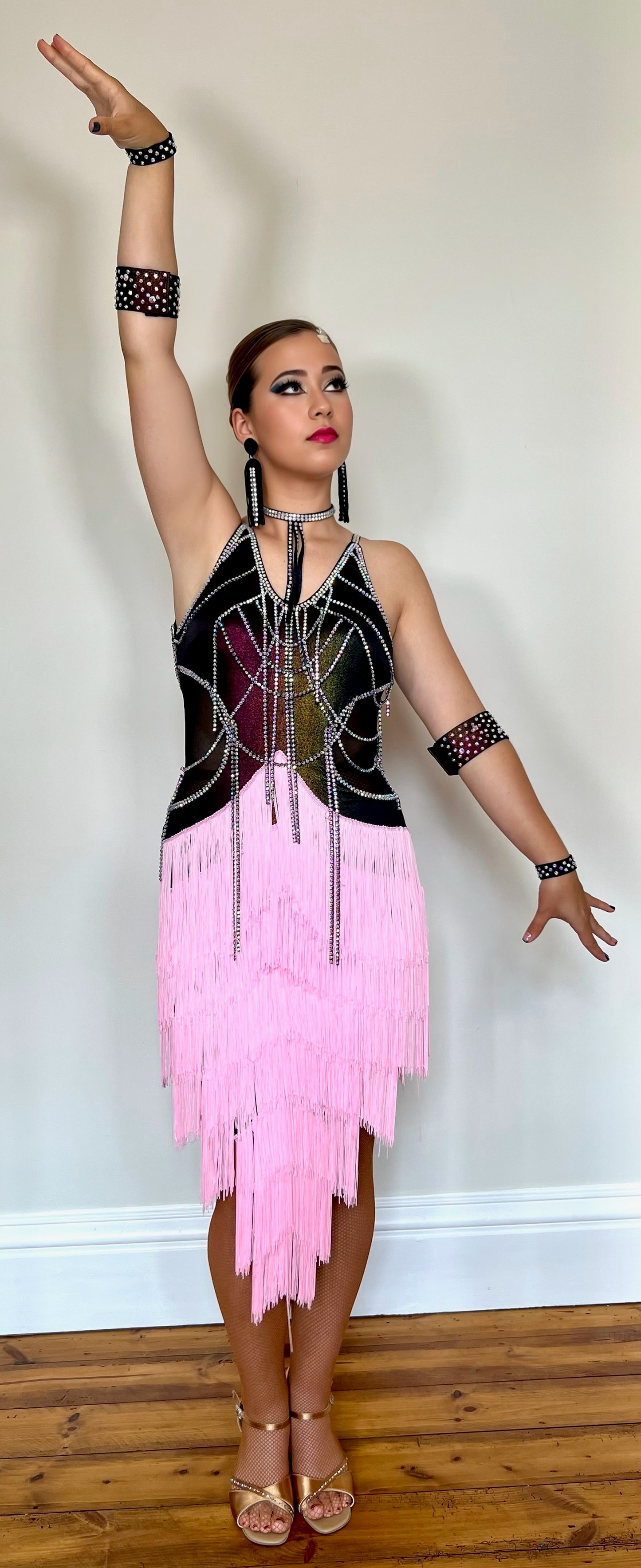 006 Multi Coloured metallic bodice with hanging material droppers. All stoned in AB with pale pink multi layered fringe skirt.