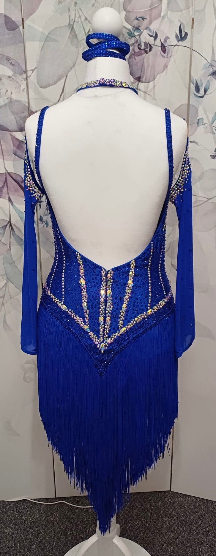 014 Royal blue Competition Latin Dance Dress. Heavily stoned in AB & Sapphire. Full fringed skirt for maximum movement. Neck detailing. Comes with long stoned gloves & Bracelets