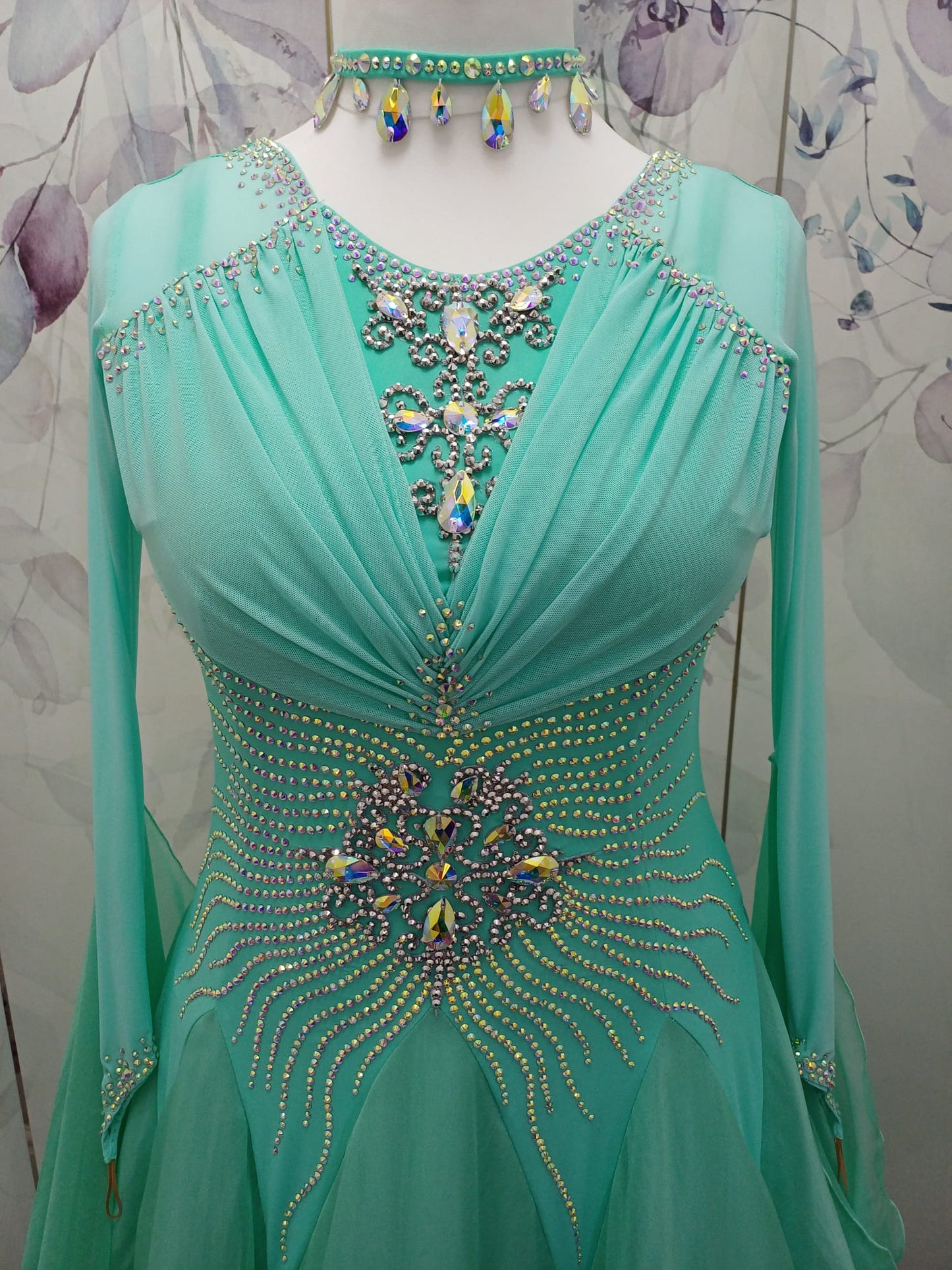 73B Pretty Mint Green Competition Ballroom Dance Dress. Stoned in AB with mesh overlay to the upper chest. Detachable Floats. ❤️Showroom Appointments Available❤️