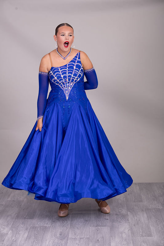 34B “TWD ELITE” Ballroom/Sequence Competition Dance Dress New Fuller Skirts & Underskirts. Striking Royal Blue Dress with web design in AB and Sapphire stoning on the bodice. Beautiful back detail with separate gloves


❤️Showroom Appointment Available❤️