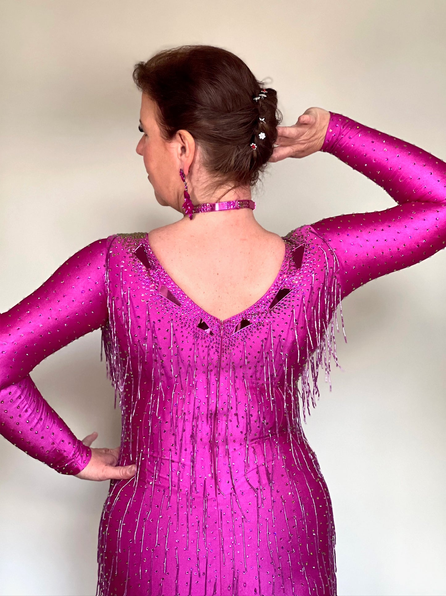 159 Elegant Fuschia Latin Dance Dress. Decorated with Fuchsia mirrors, stones & bead droppers. High back to give option for wearing own bra.