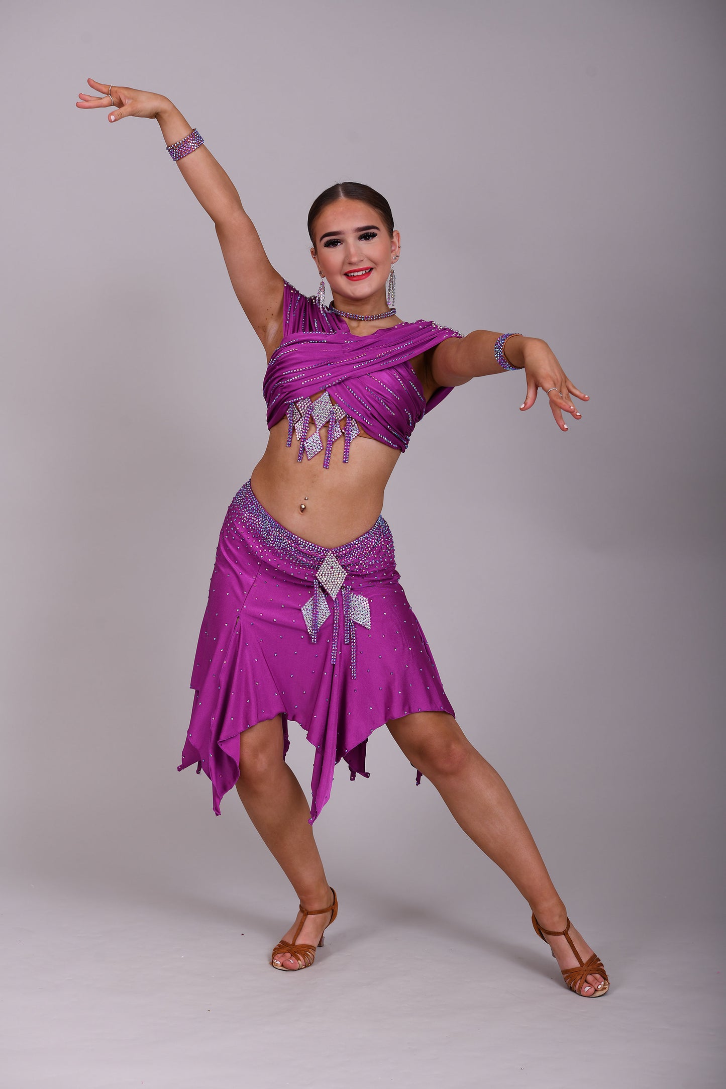 186 Stunning Latin 2 Piece. Full handkerchief skirt. Skirt comes with a choice of 2 tops. Stoned in Fuchsia AB & Fuchsia. Please add note at checkout choice of top required.