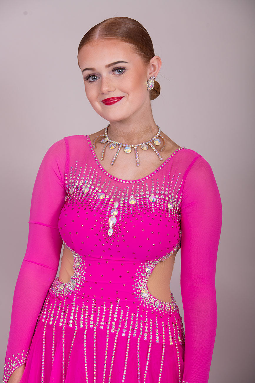00002 Fuchsia Pink flesh side panel Ballroom Dress. AB stoned material droppers from the waist stoned with Ab throughout