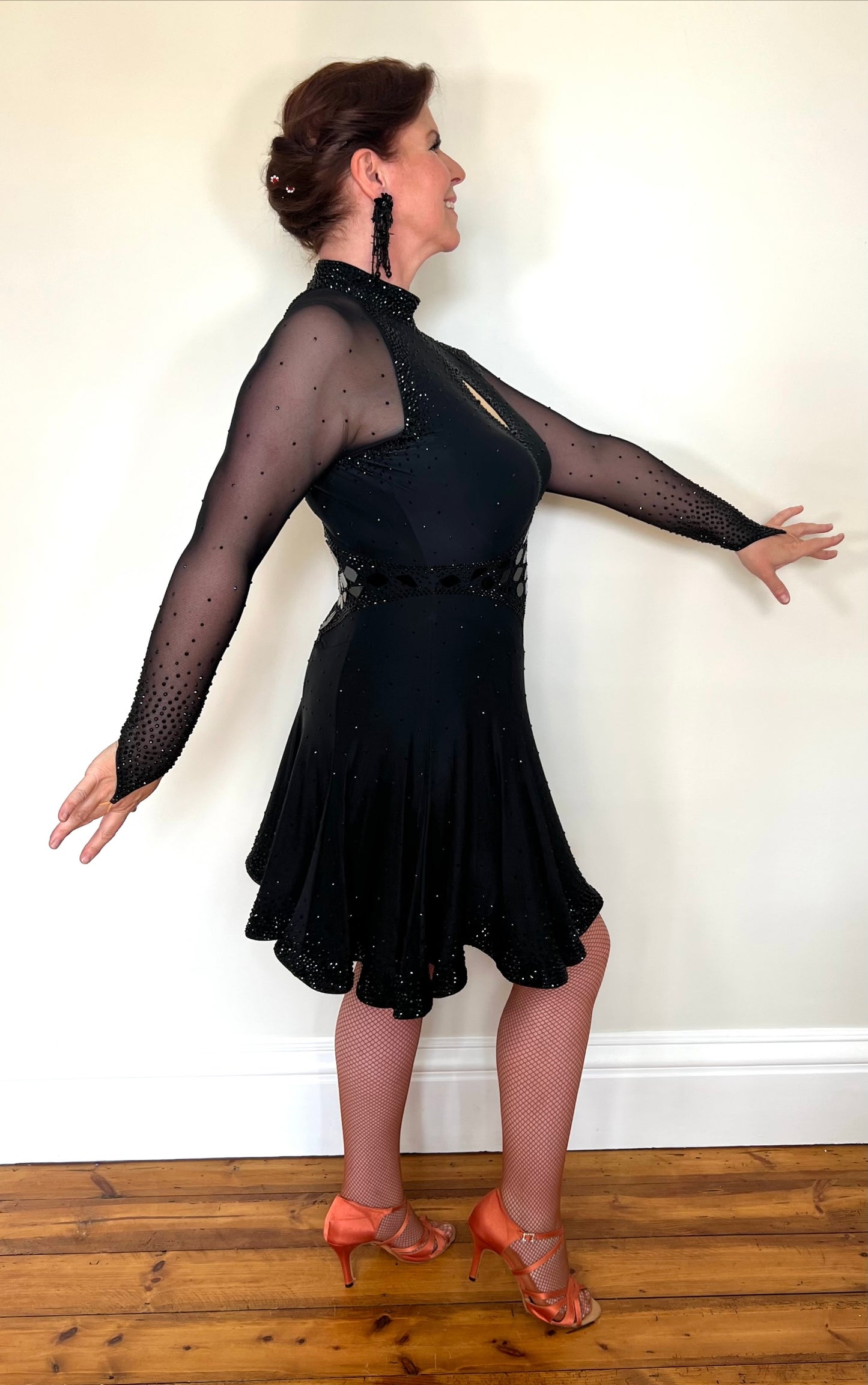 179 Classy Black Latin Dance Dress. Stones in Jet with Jet Mirrors. Stoned Front Side split giving lots of movement to a very full skirt. High back for option of wearing own bra.