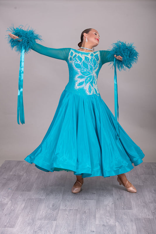 26B “TWD ELITE” Teal competition Ballroom/Sequence Dance dress. New Fuller skirts/Underskirts with 3D design to front and back. Stoned in AB & Blue Zircon. Detachable Ostrich Feather Floats