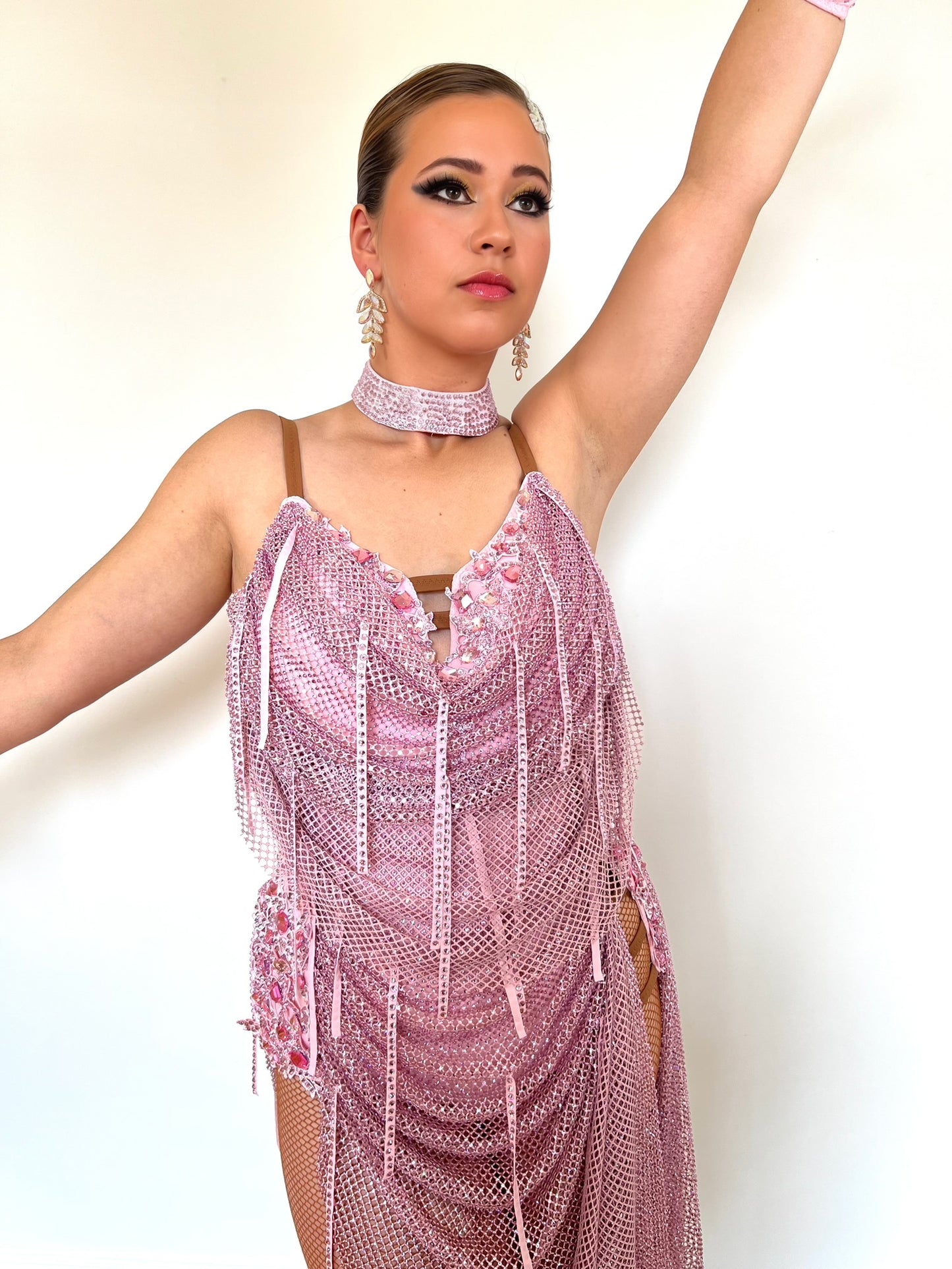 016 Dusky Pink stoned mesh overlay Latin Dress. Stoned in Light Pink with material droppers stoned. Pale pink appliqués with rose stones.